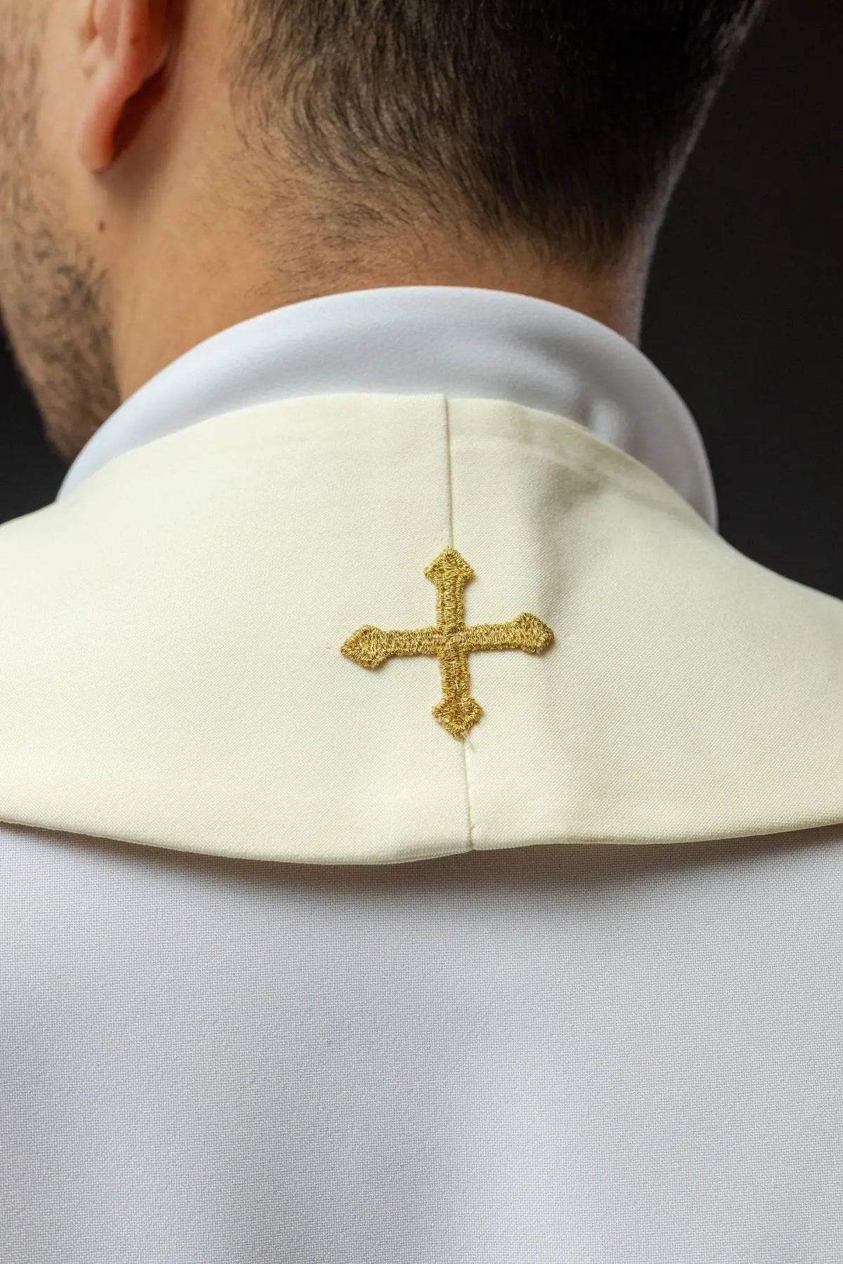 Ecru stole with a gold embroidered cross, back view