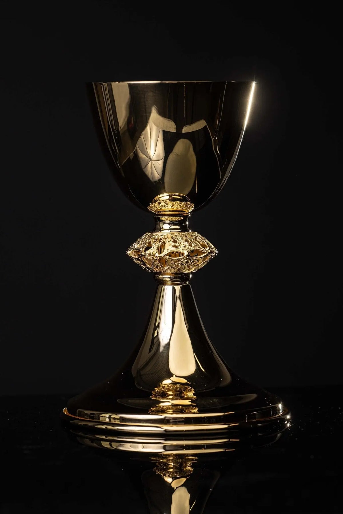 Gold-plated brass chalice with openwork floral ornament, full front view