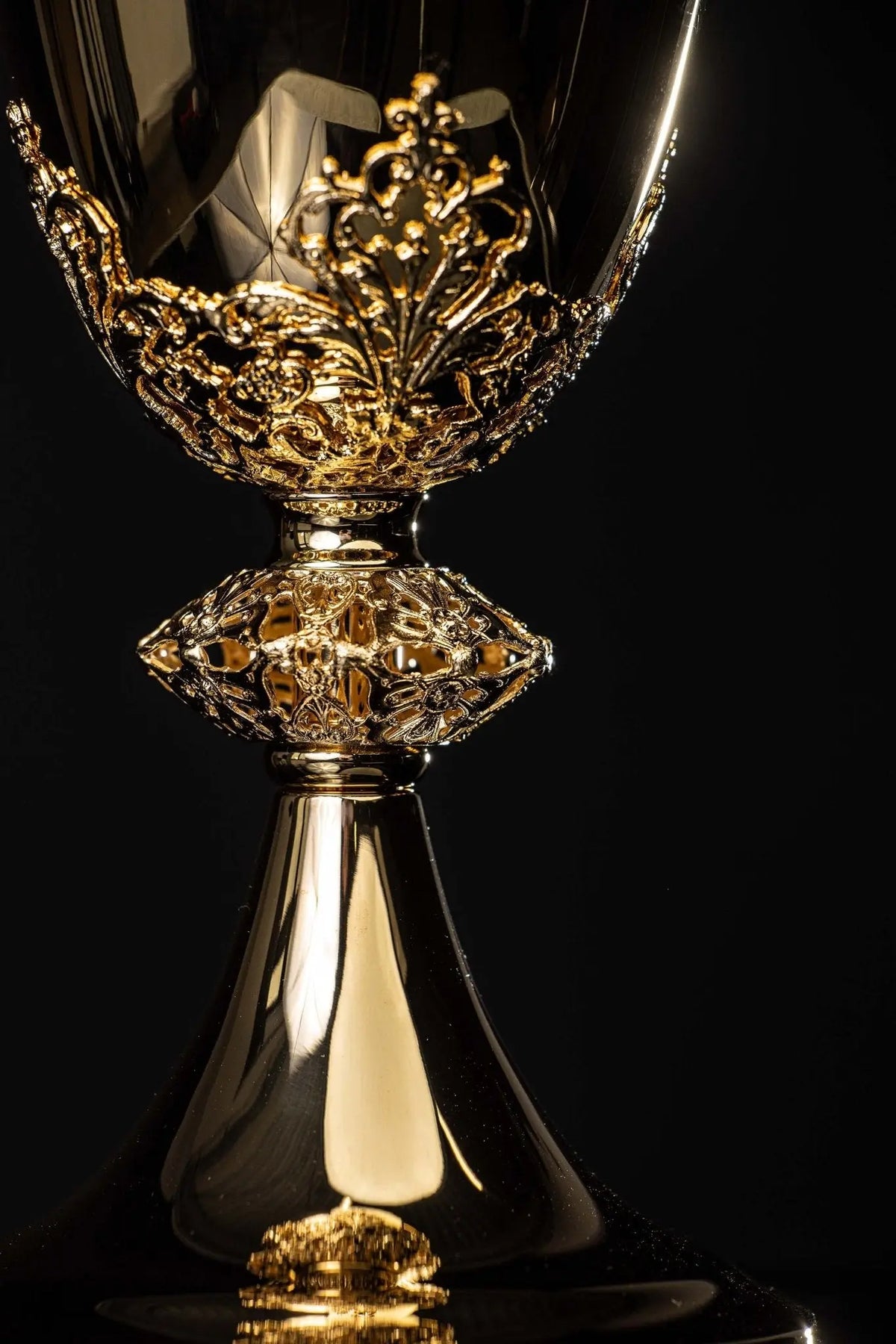 Gold-plated brass chalice with floral ornament, front view of cup and base