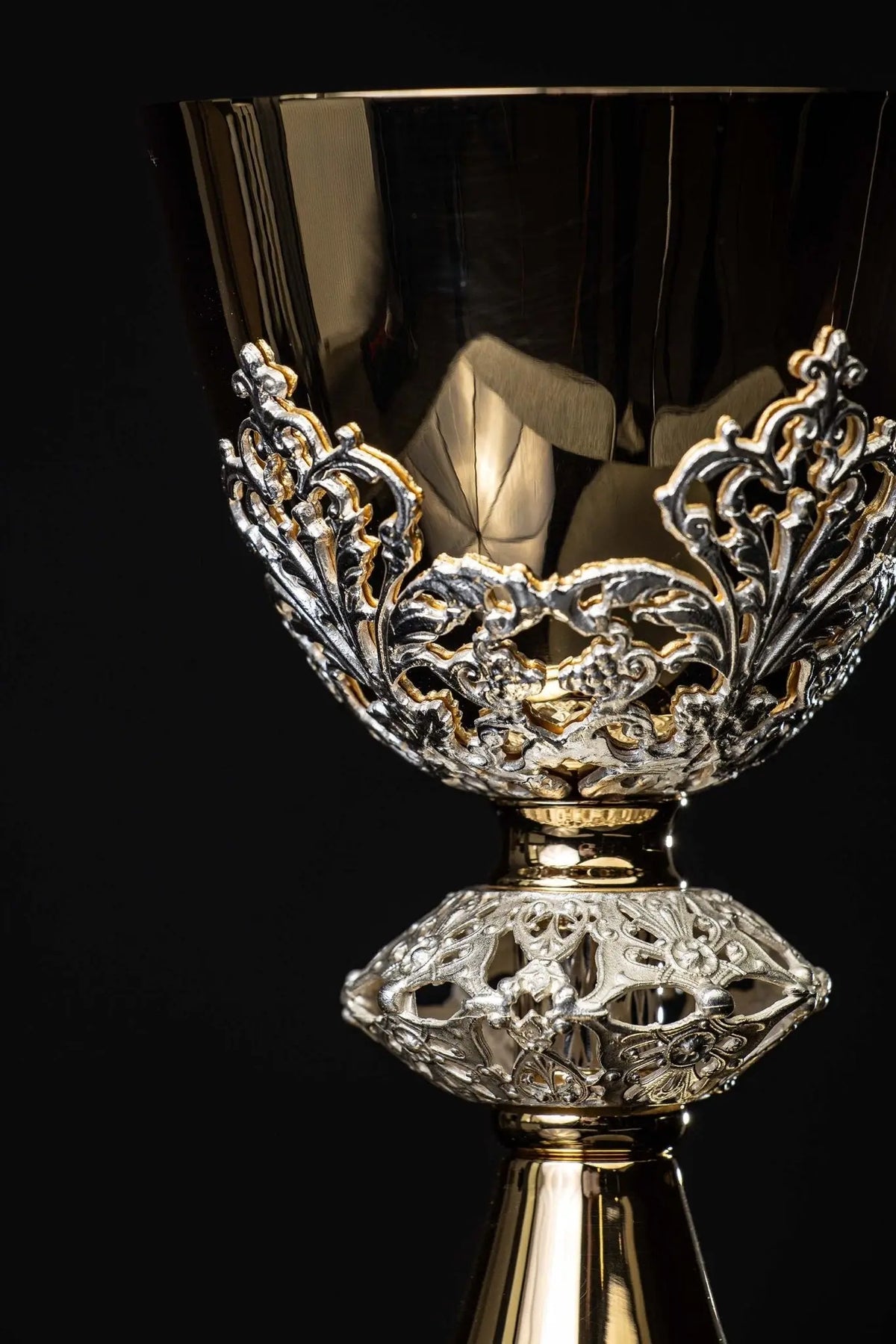 Gold-plated brass chalice with botanical ornament, close-up of cup and base