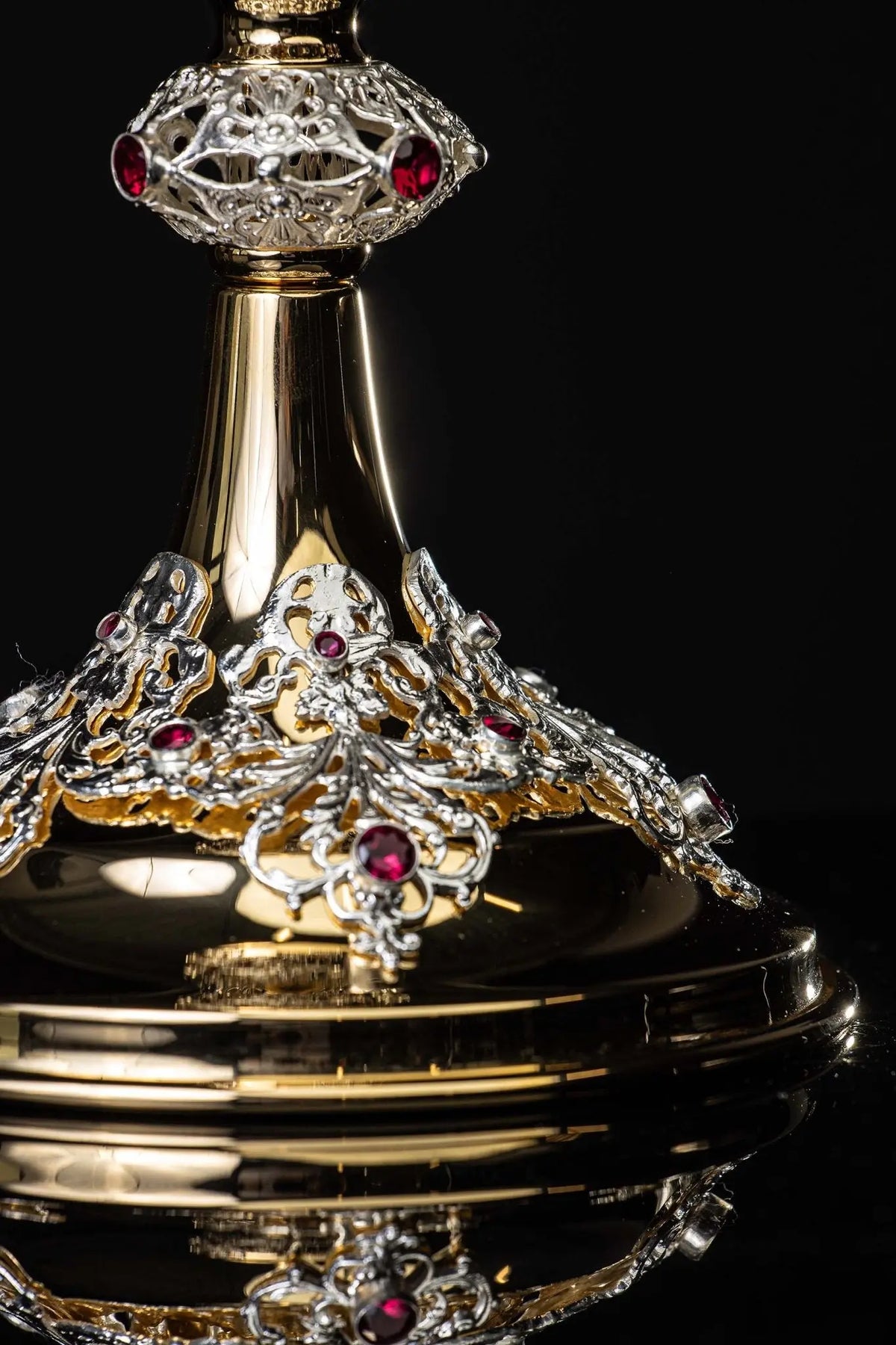 Gold chalice with openwork plant ornaments and rubies, base detail view