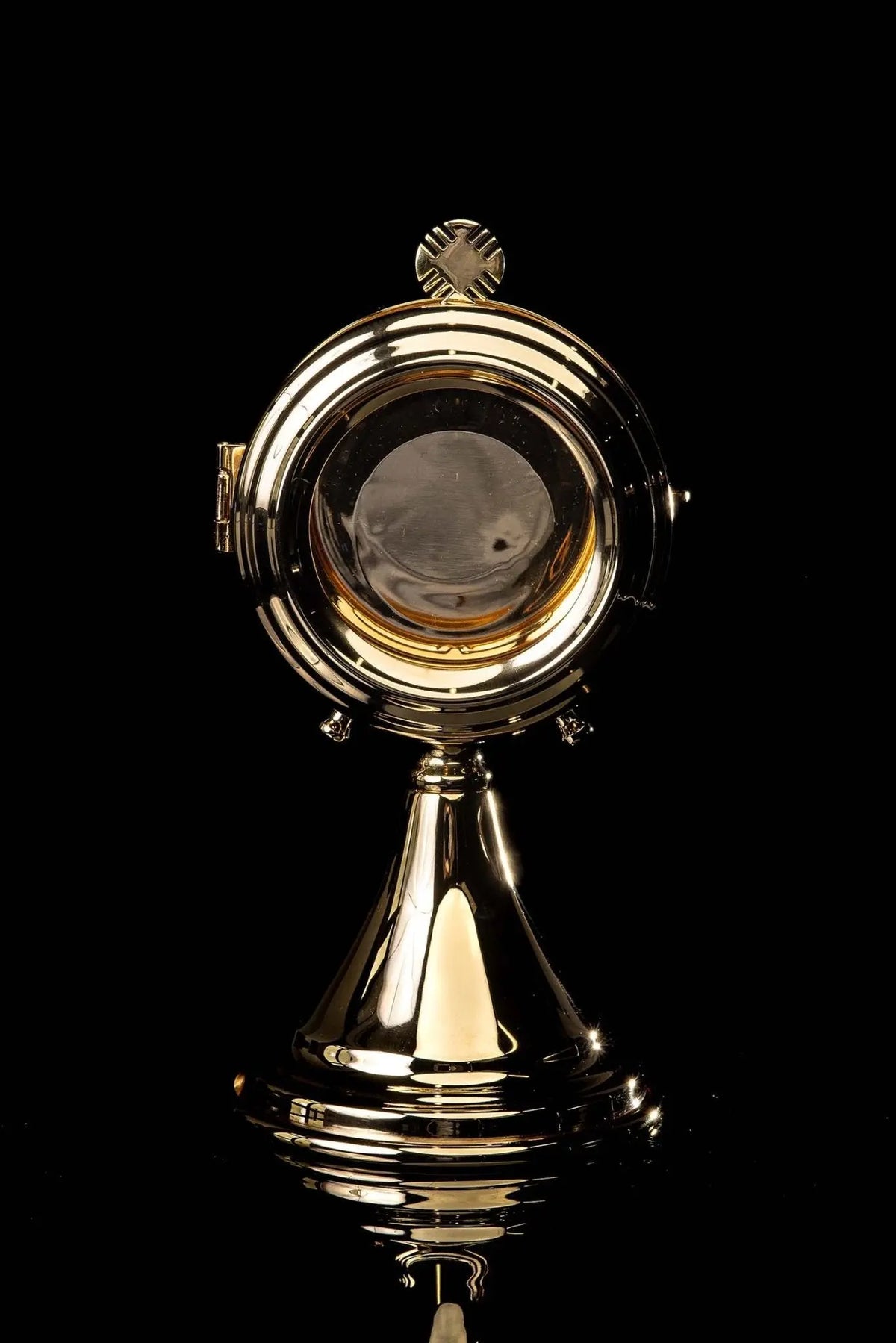 Brass luna holder with visible host compartment, back view