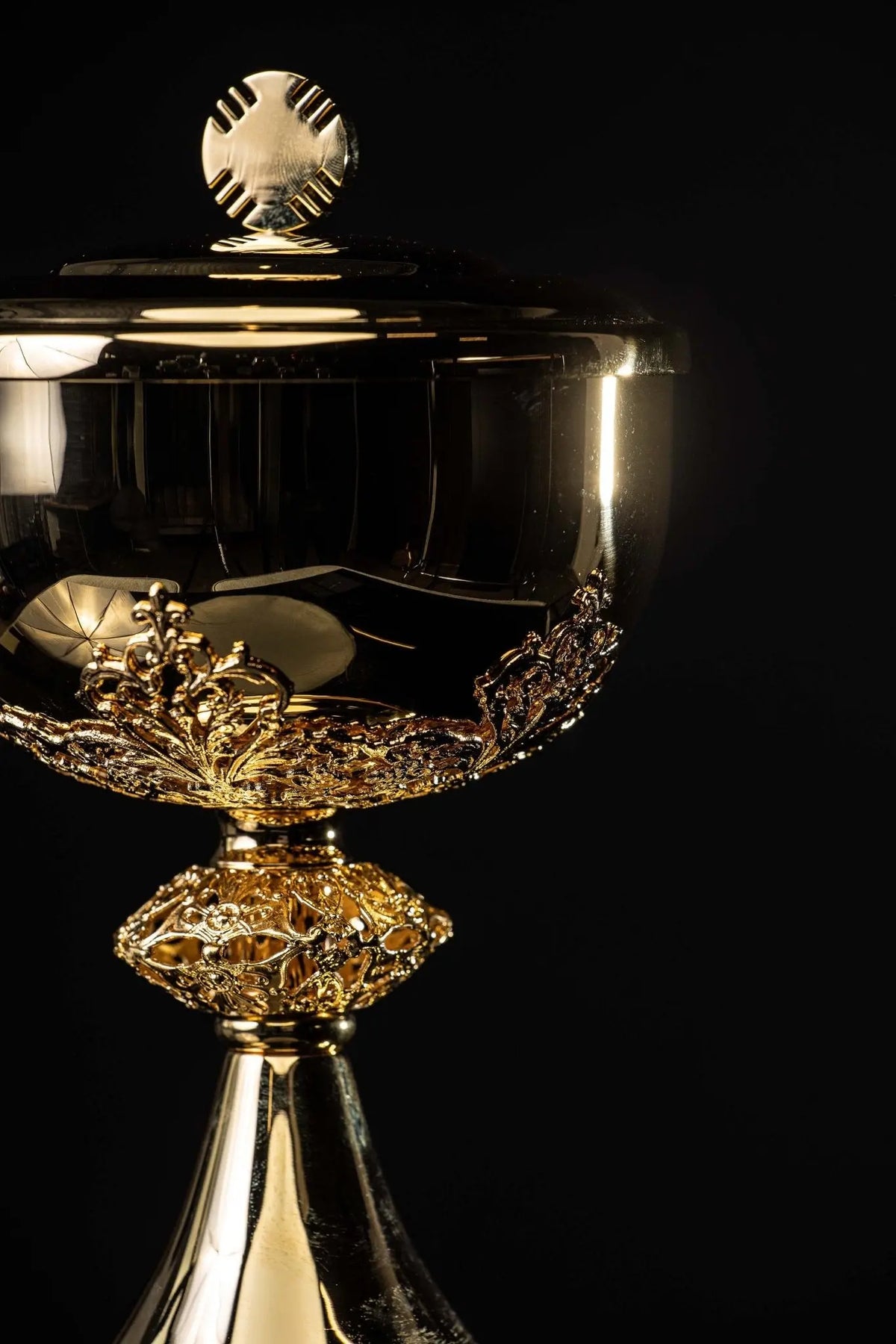 Gold ciborium with floral ornaments, side view