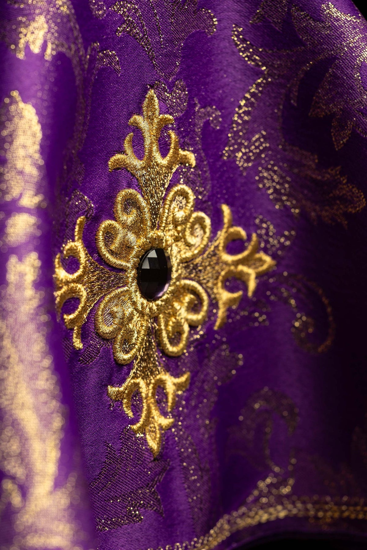 Purple ciborium veil with embroidered cross, close-up of gold embroidery