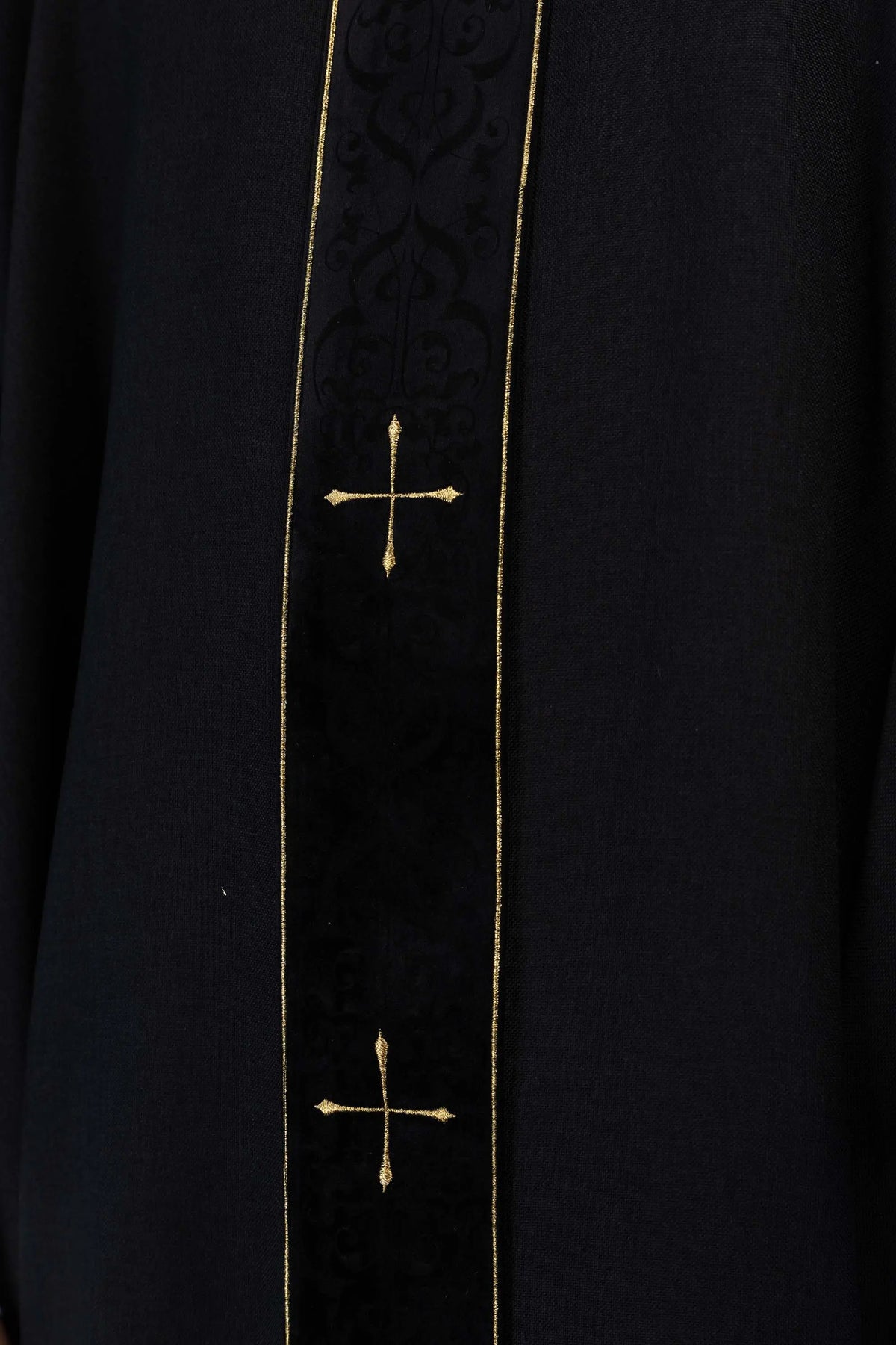 Black chasuble with gold crosses, central panel embroidery close-up