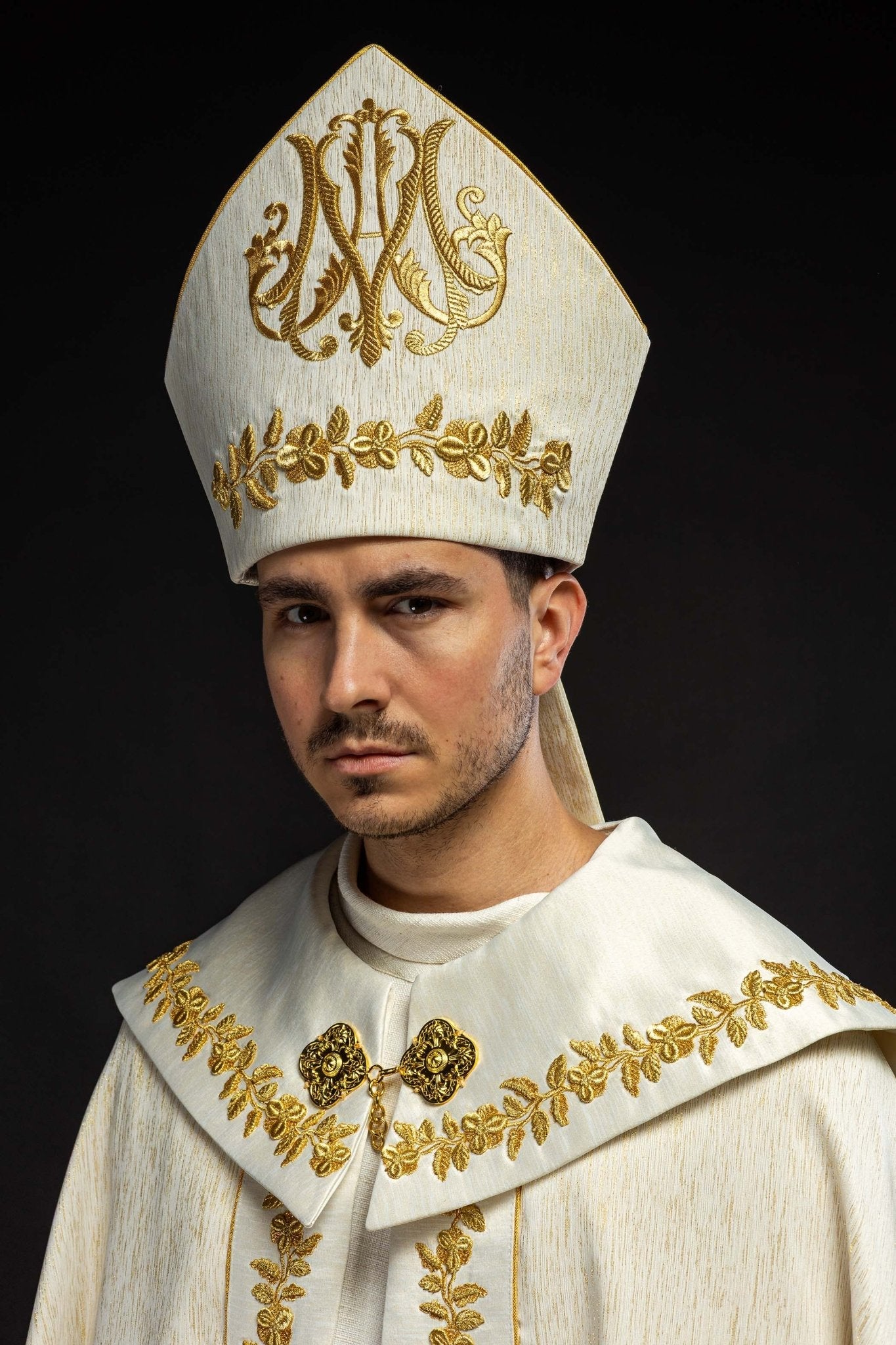 Ecru Marian mitre with rich gold embroidery and floral patterns