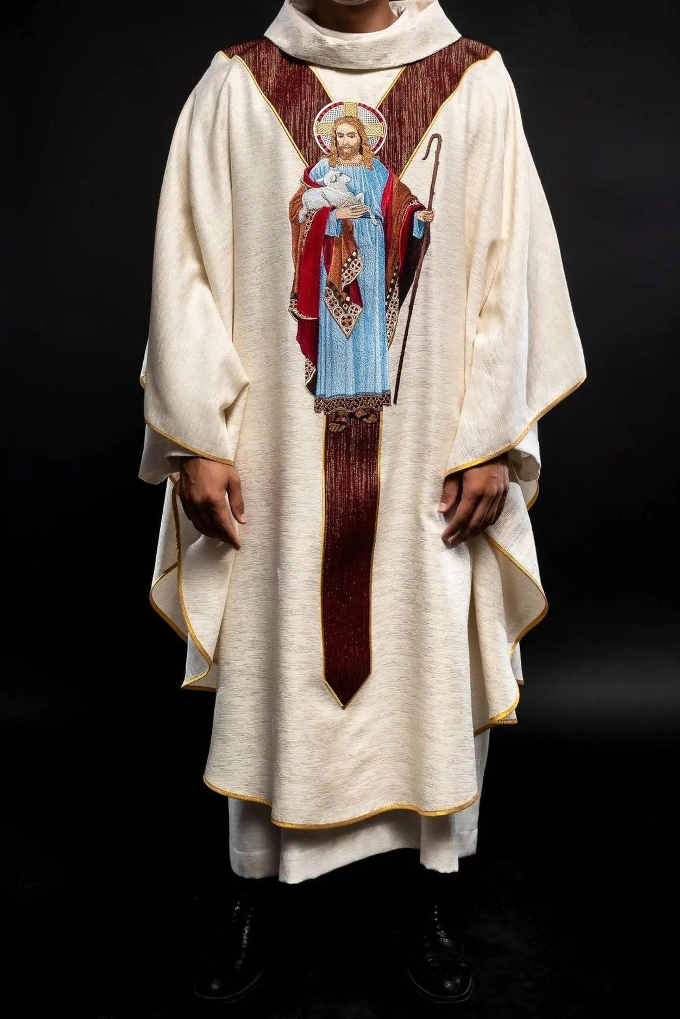 Chasuble ecru with the image of Jesus the Good Shepherd with a decorative burgundy stripe