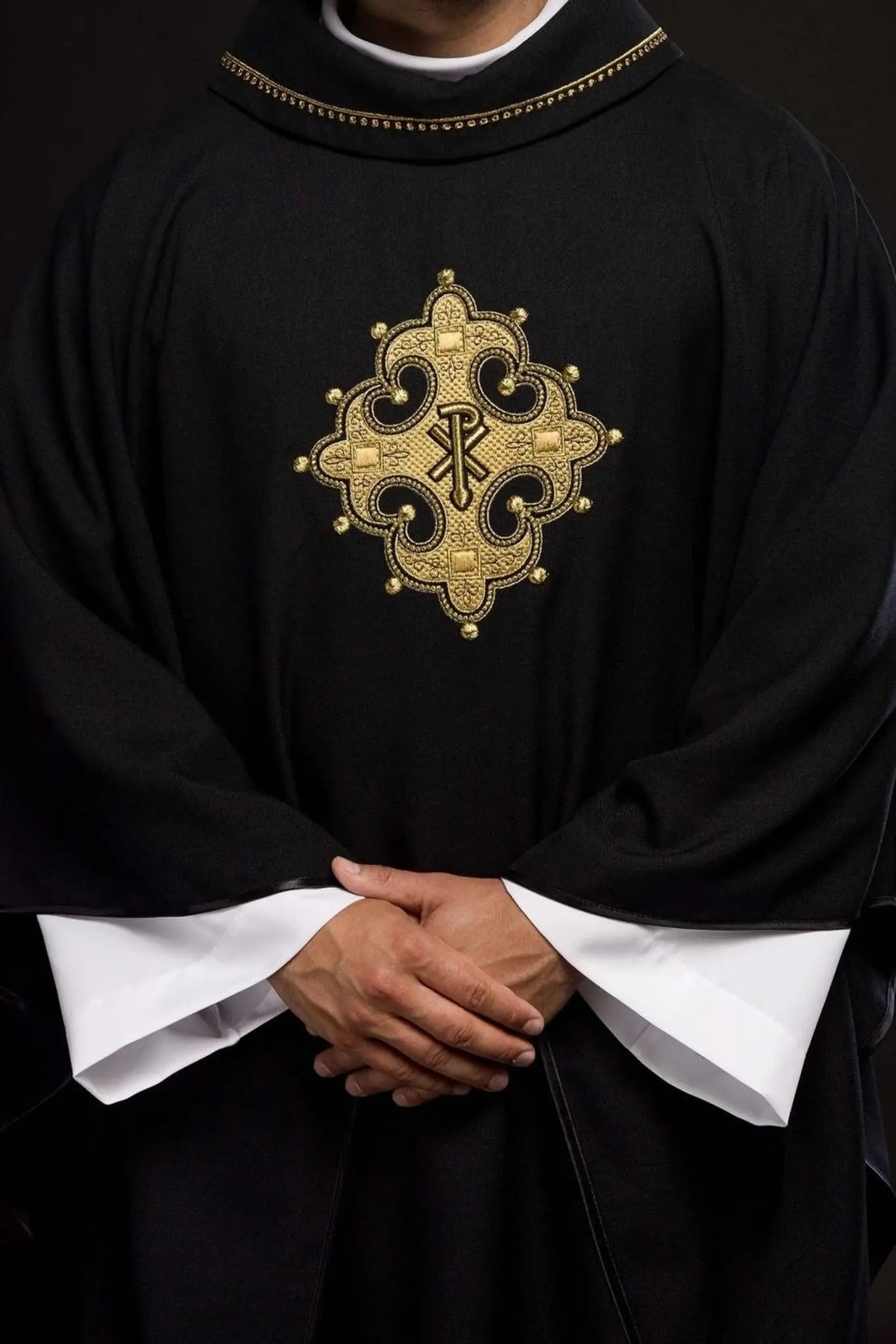 Chasuble with embroidered cross and gold trim on collar in black