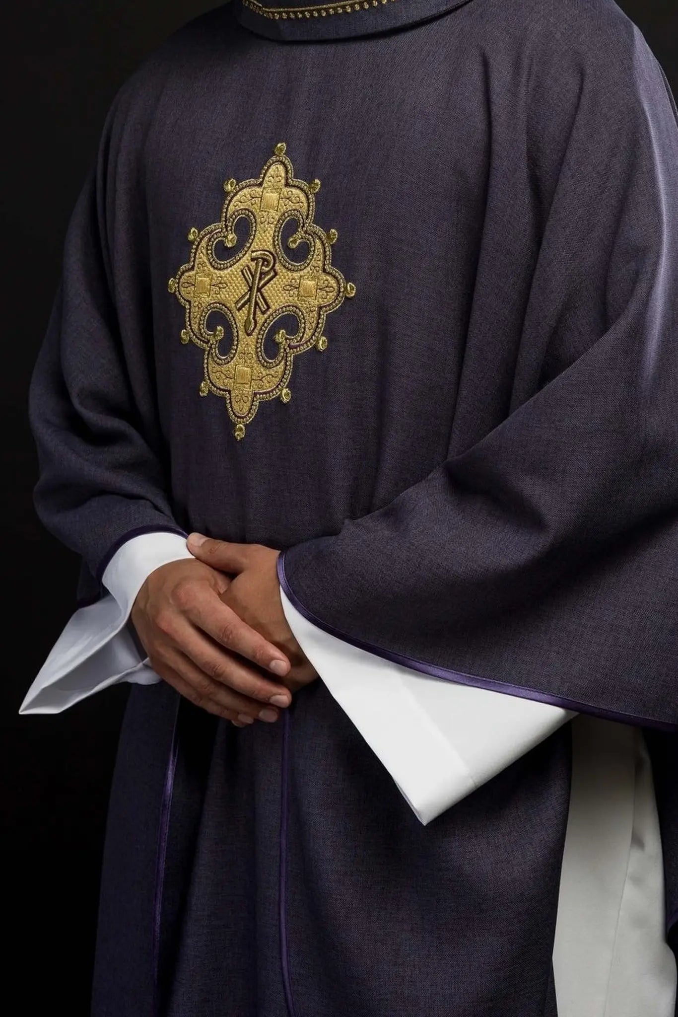 Chasuble with embroidered cross and gold trim on the collar in purple