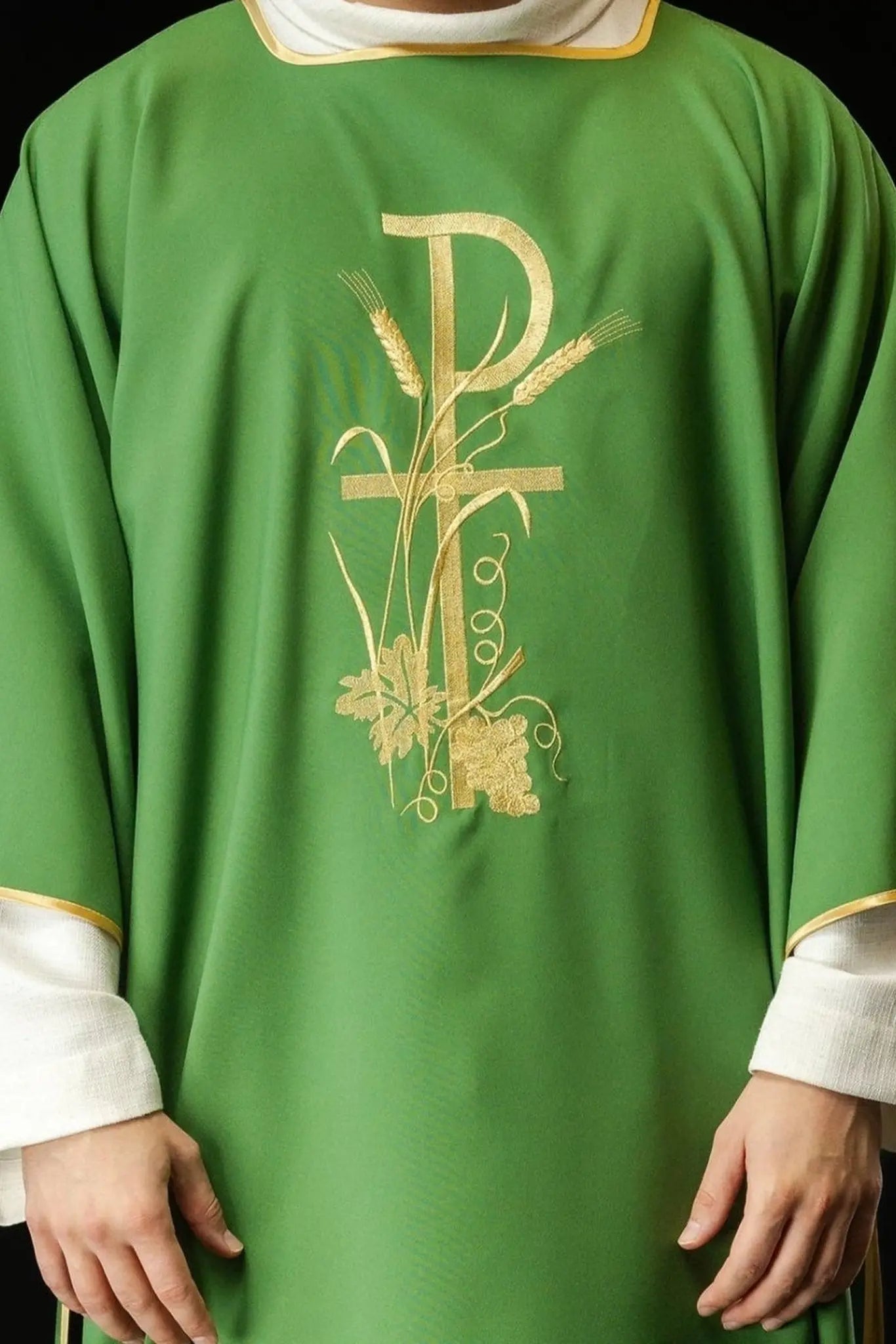 Green dalmatics with gold Pax cross embroidery