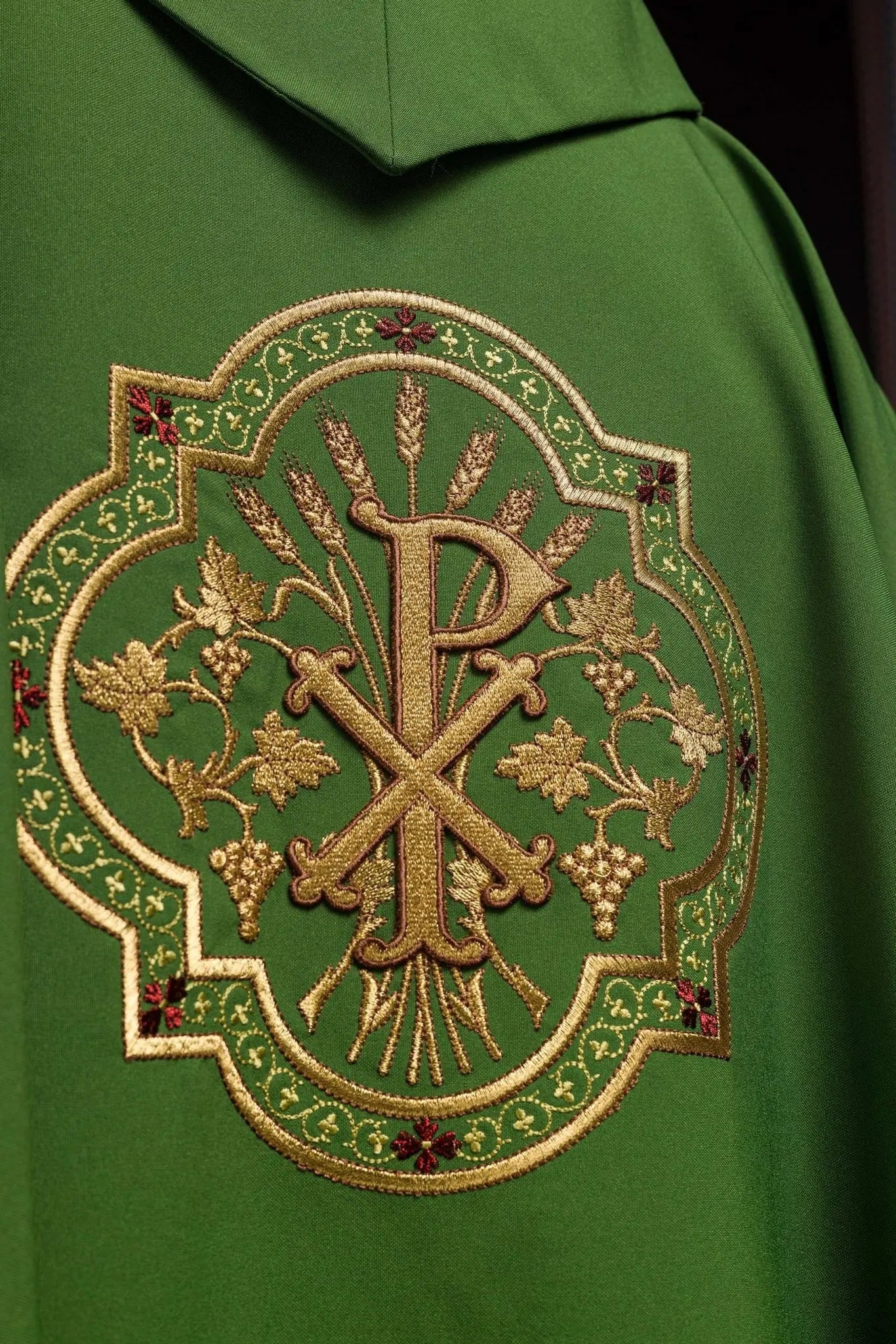 Green chasuble with IHS and PAX embroidery