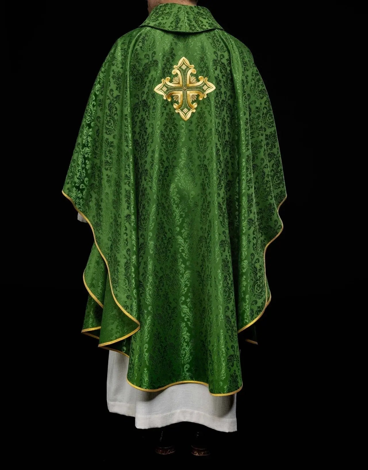 Green chasuble with cross sewn from patterned fabric