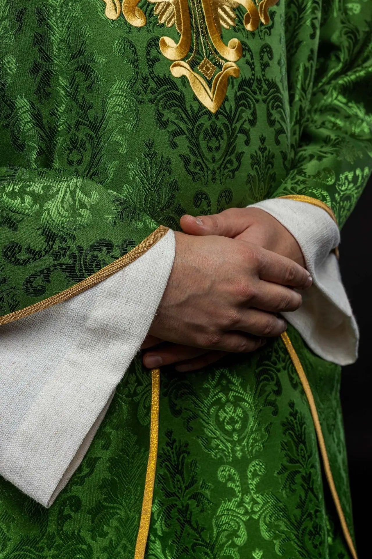 Green chasuble with cross sewn from patterned fabric