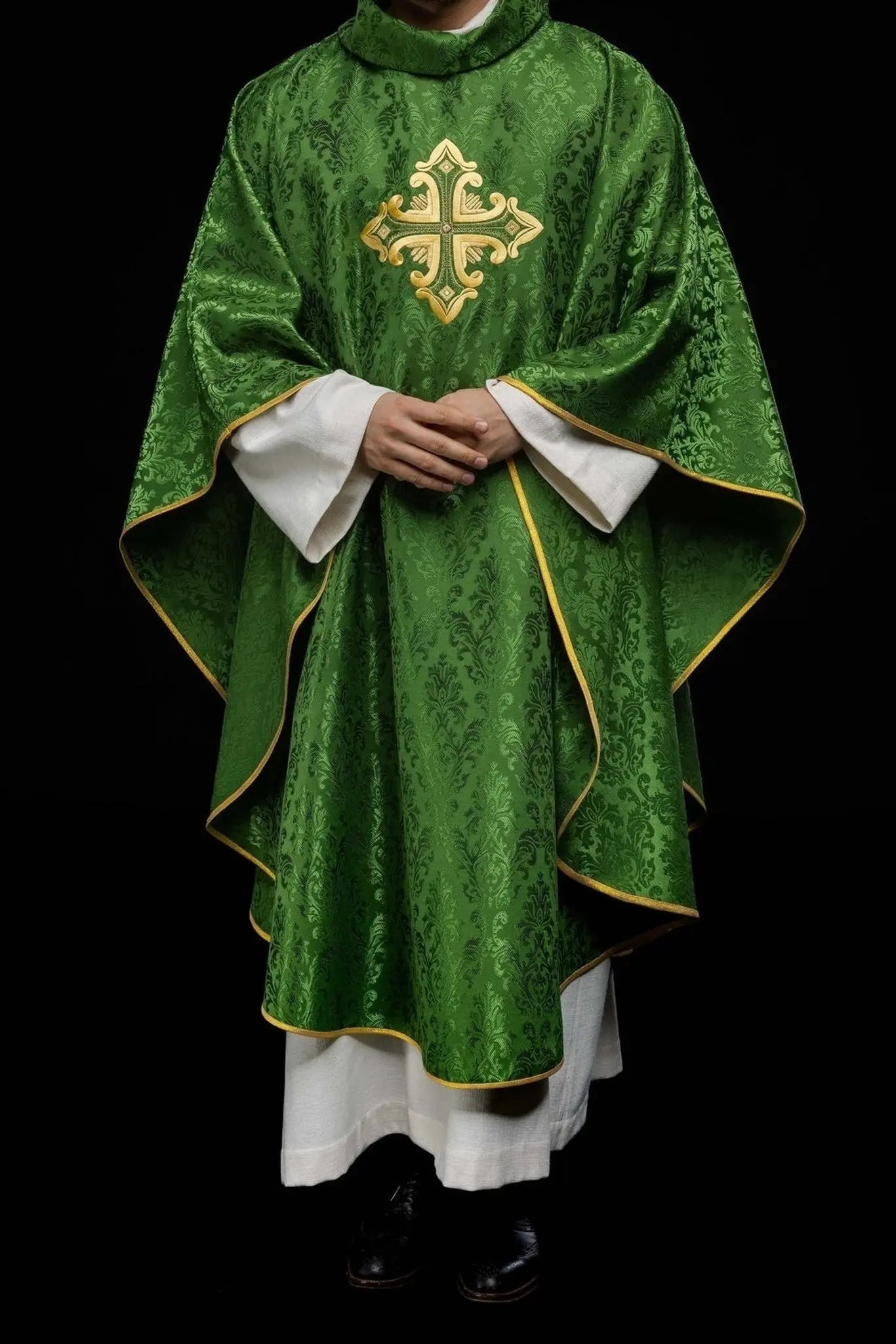 Green chasuble with cross sewn from patterned fabric