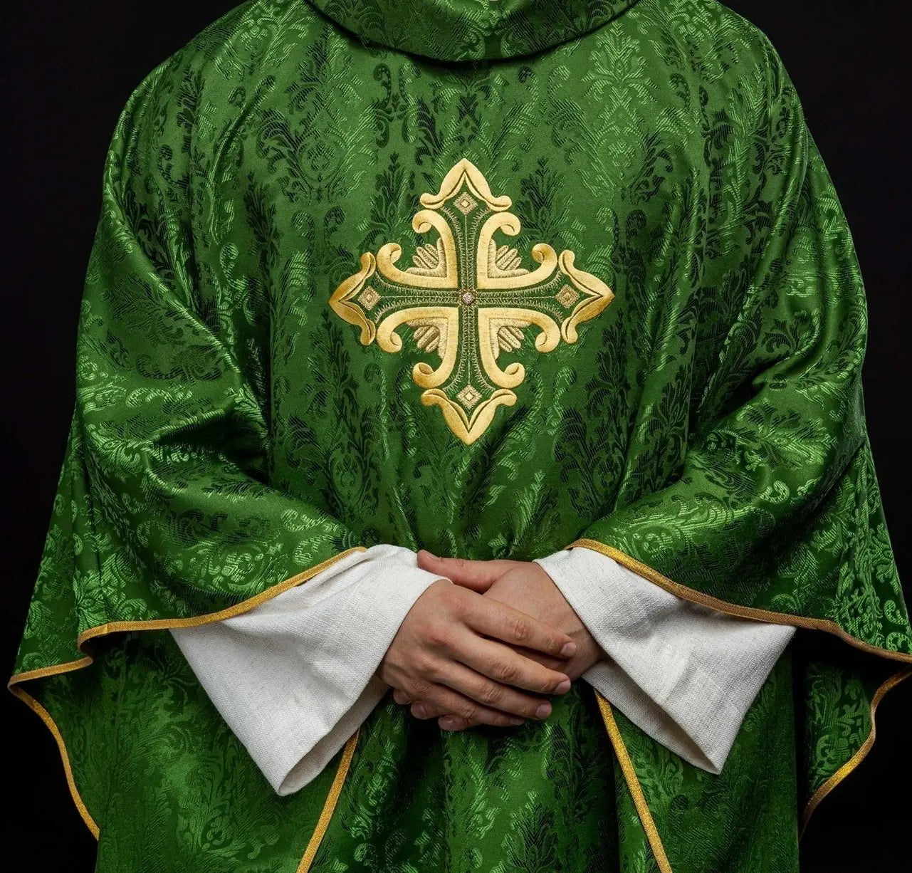 Green chasuble with cross sewn from patterned fabric