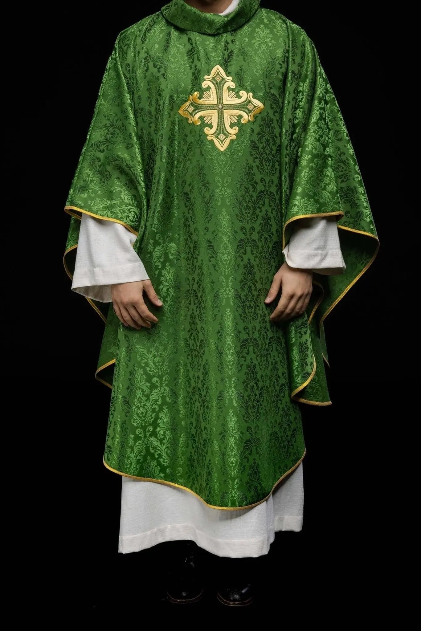 Green chasuble with cross sewn from patterned fabric