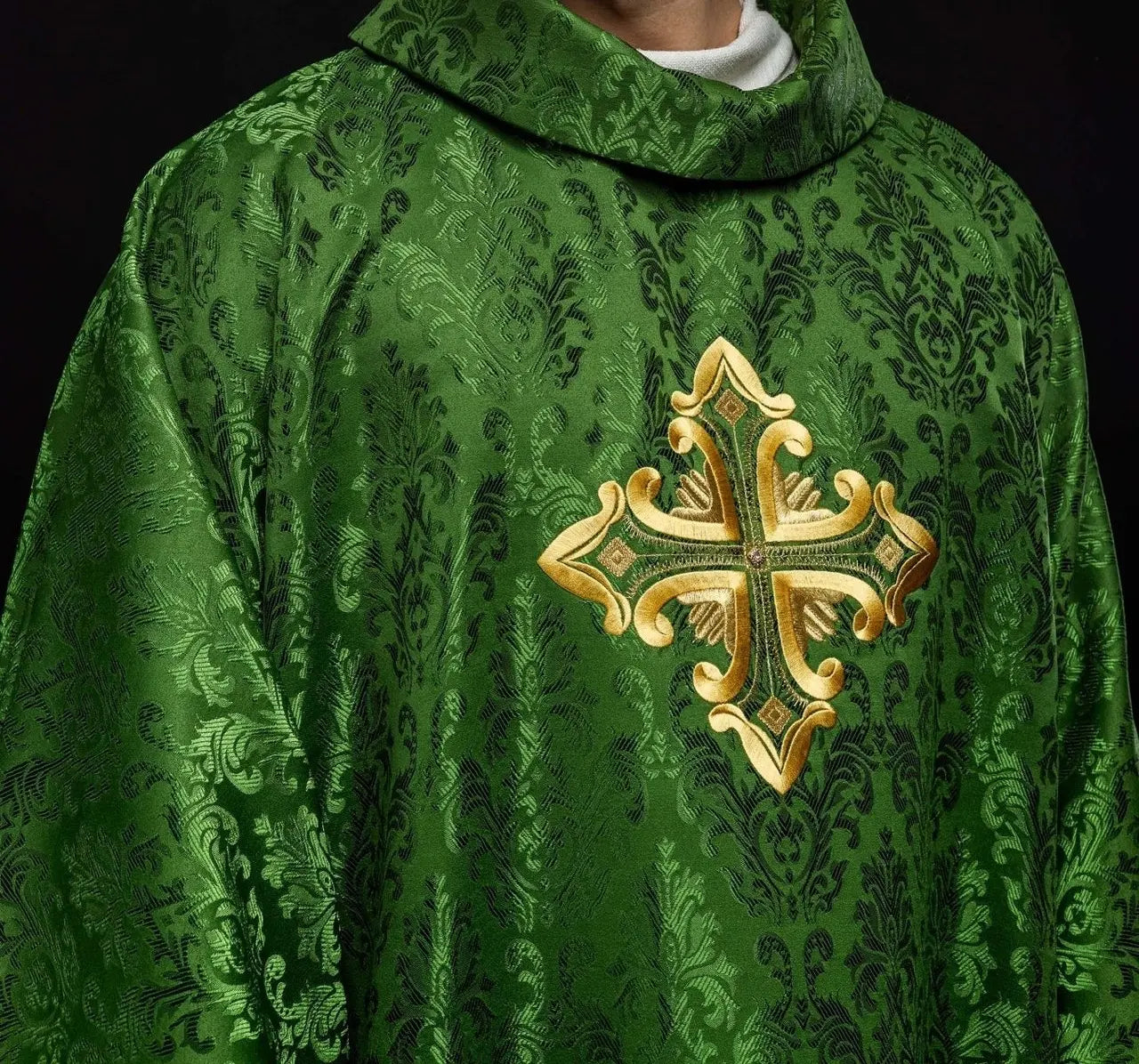 Green chasuble with cross sewn from patterned fabric