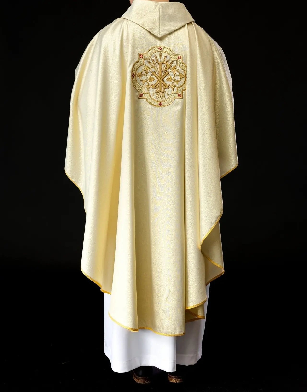 Gold chasuble with IHS and PAX embroidery