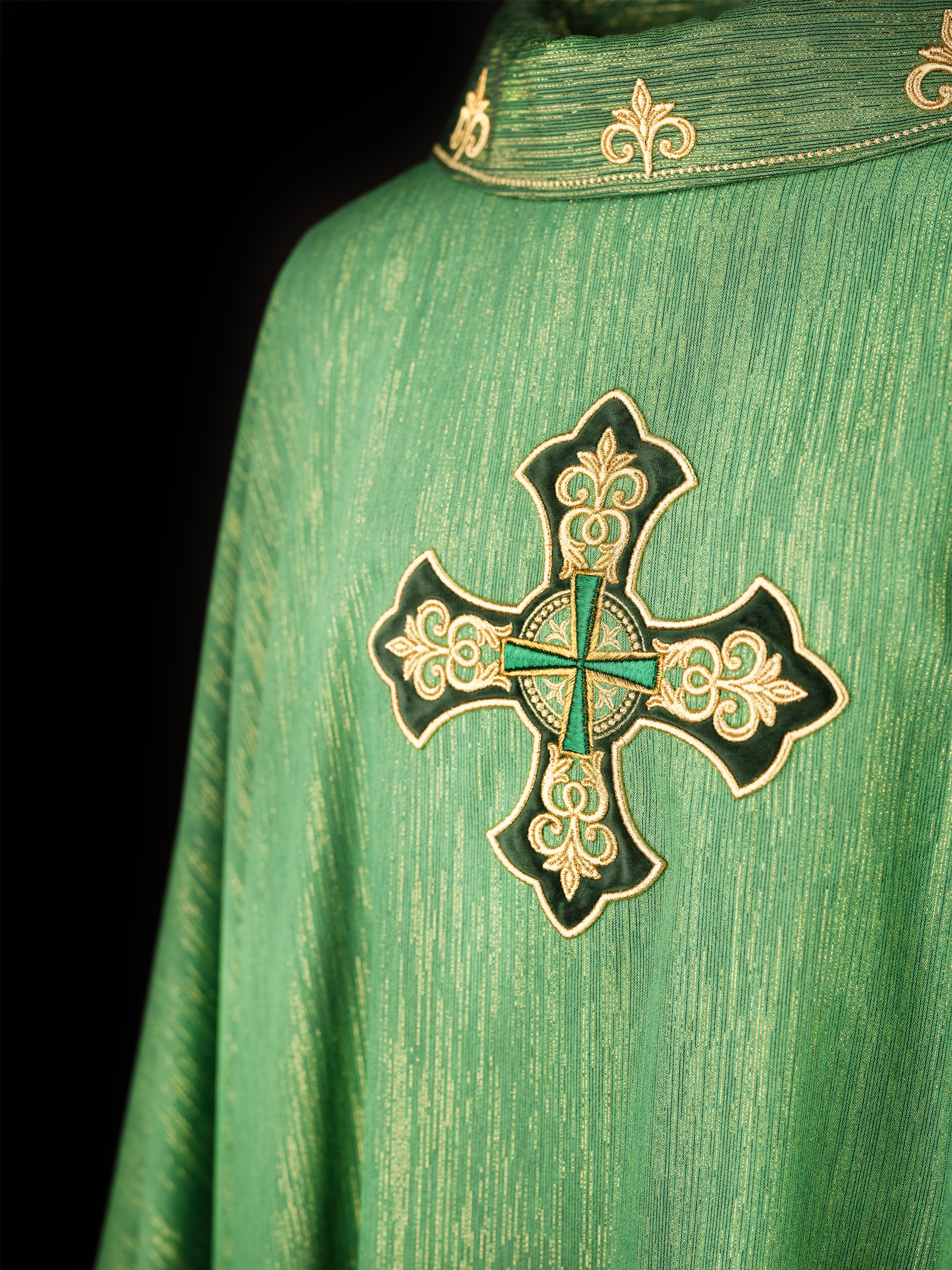 Green chasuble with richly embroidered cross and decorated collar