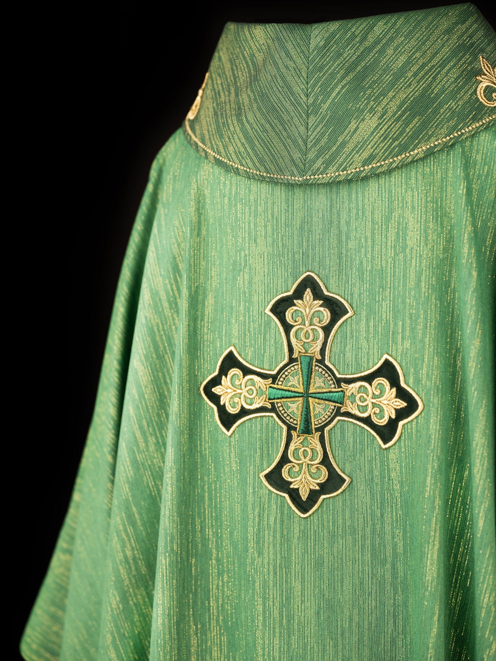 Green chasuble with richly embroidered cross and decorated collar