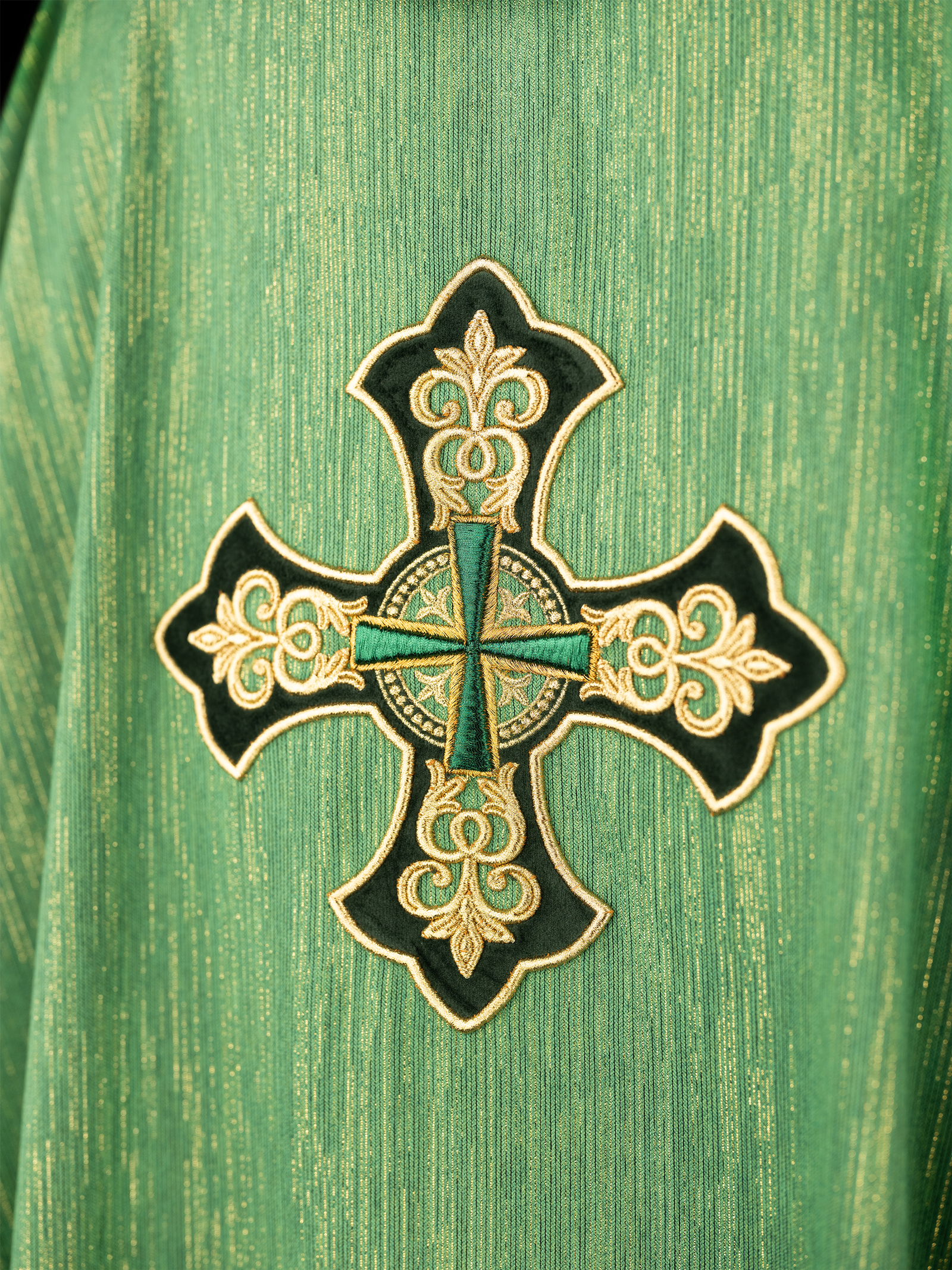 Green chasuble with richly embroidered cross and decorated collar