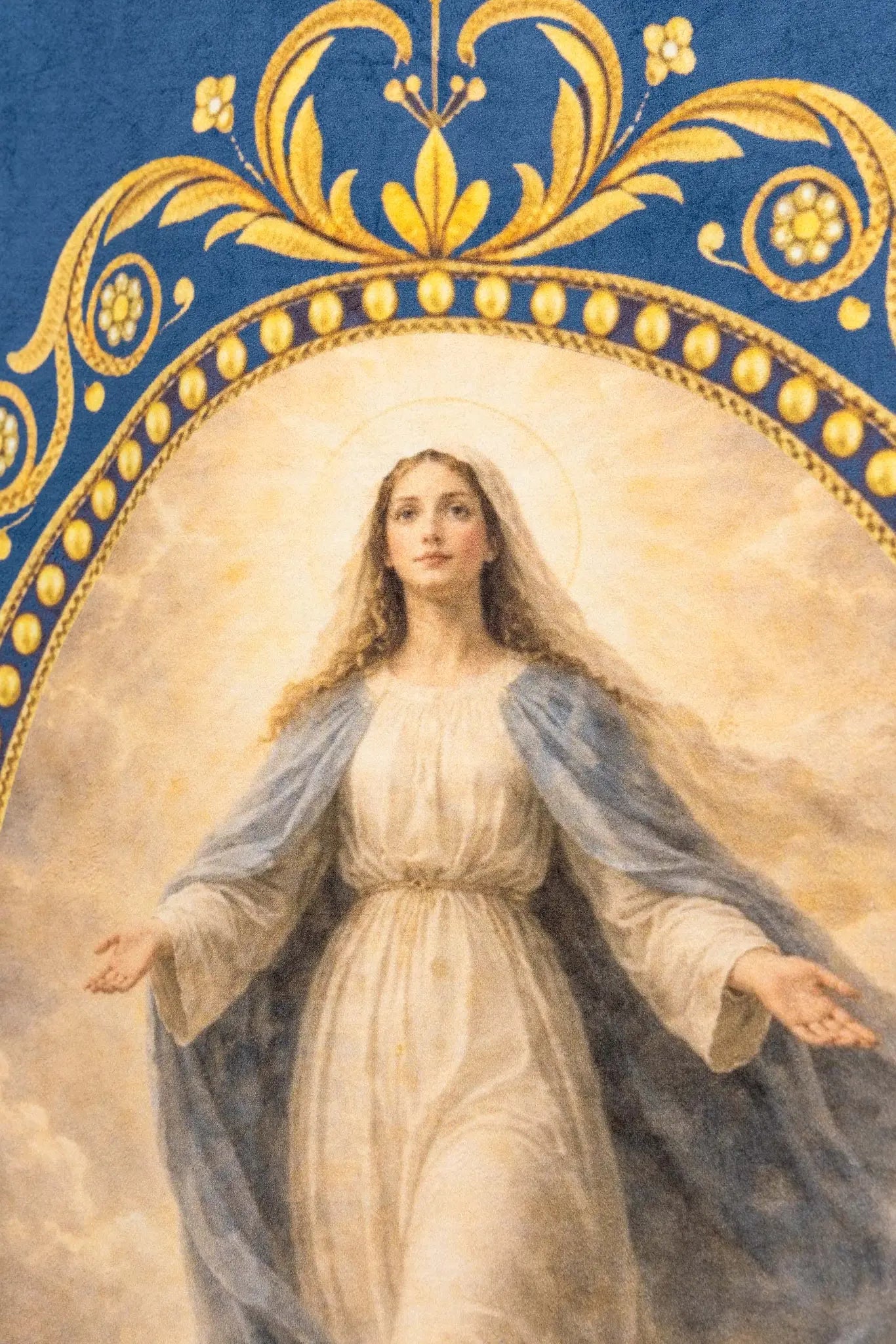 Double-sided processional banner with Our Lady of the Assumption on one side and a Marian monogram on the other, made of velour fabric with gold ornaments and fringes.