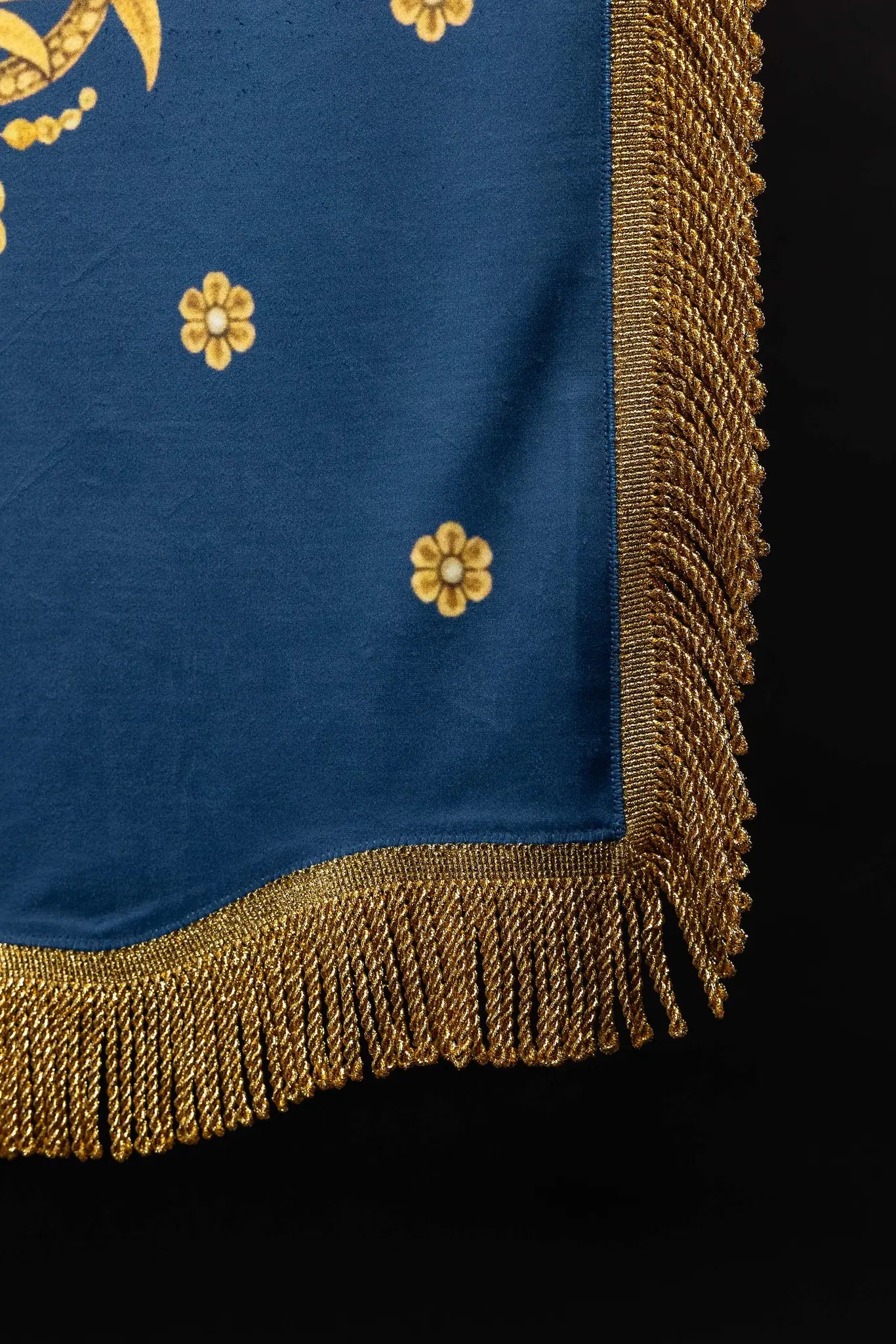 Double-sided processional banner with Our Lady of the Assumption on one side and a Marian monogram on the other, made of velour fabric with gold ornaments and fringes.