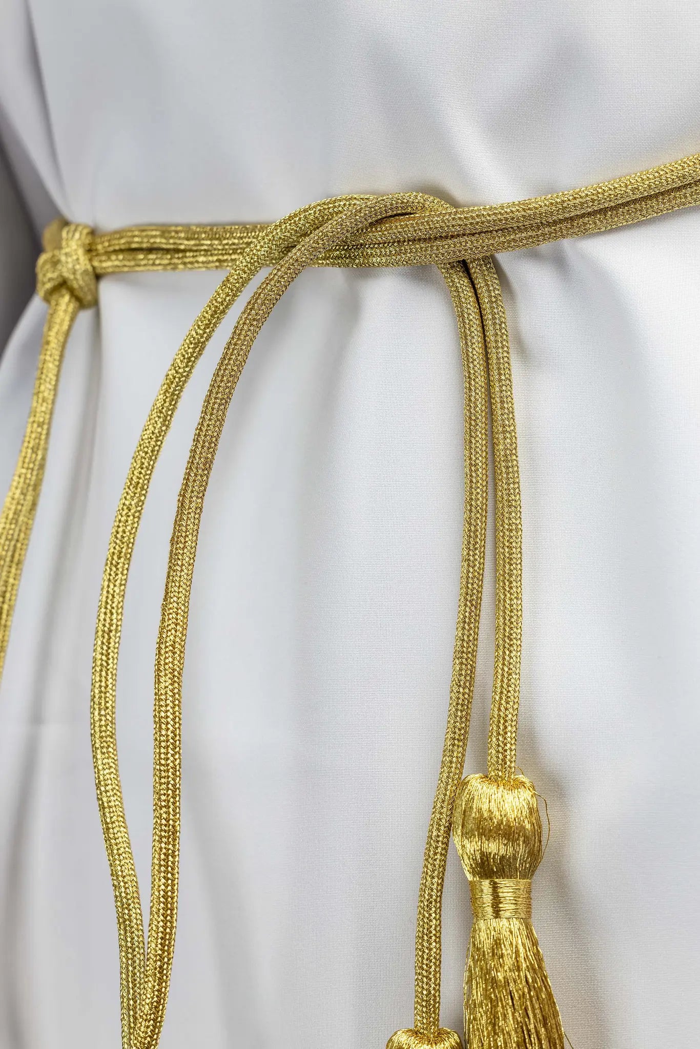 Gold liturgical cincture with decorative tassels made from braided cord