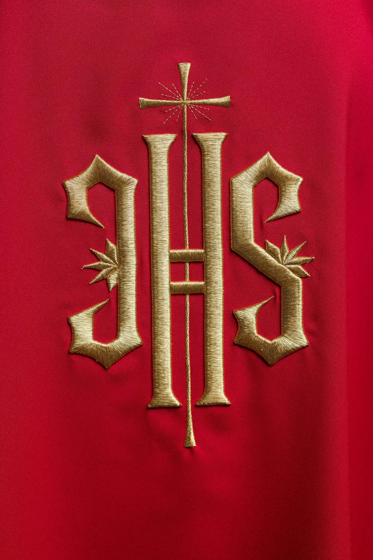 Red Dalmatics with embroidered gold IHS