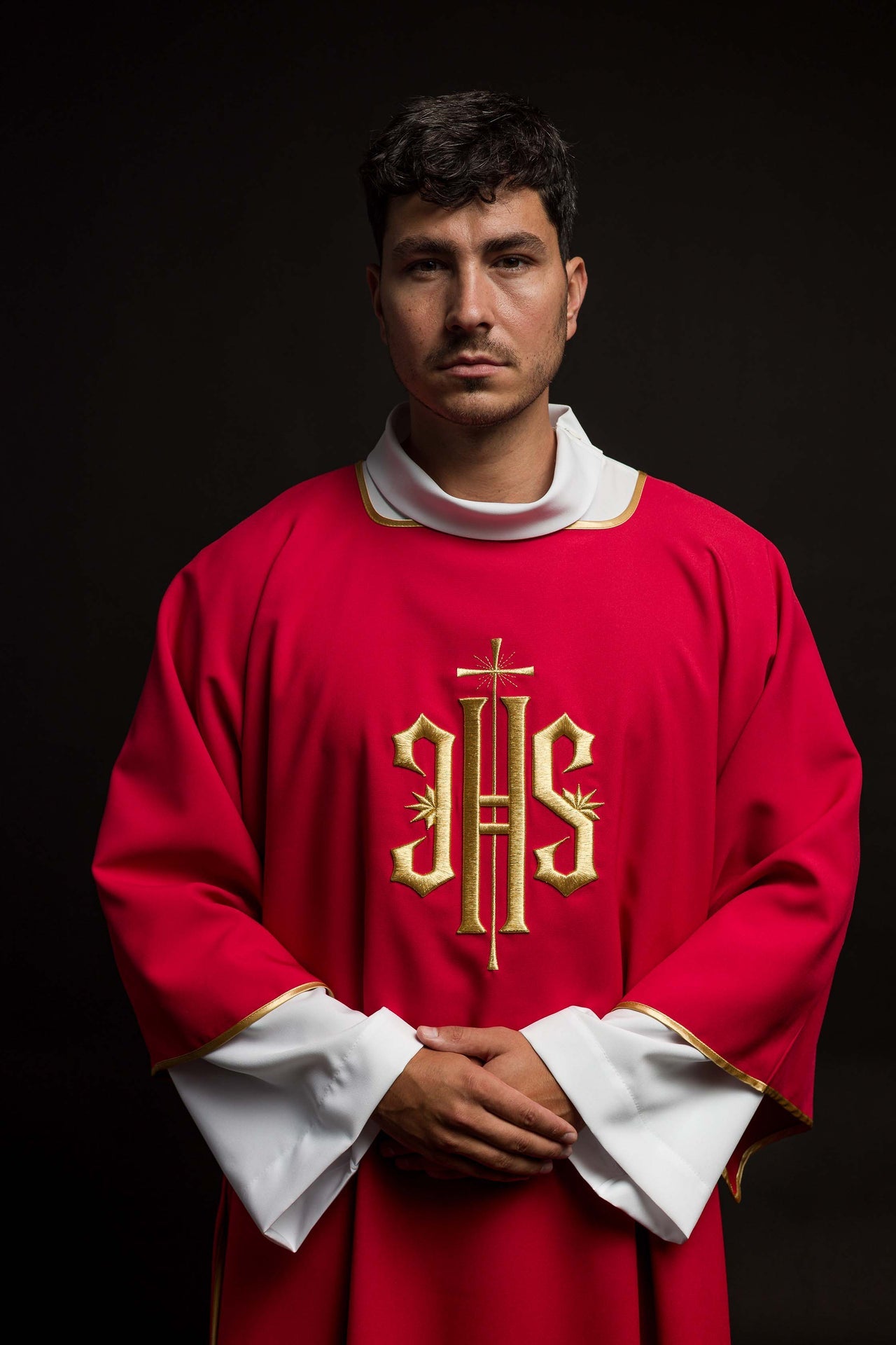 Red Dalmatics with embroidered gold IHS