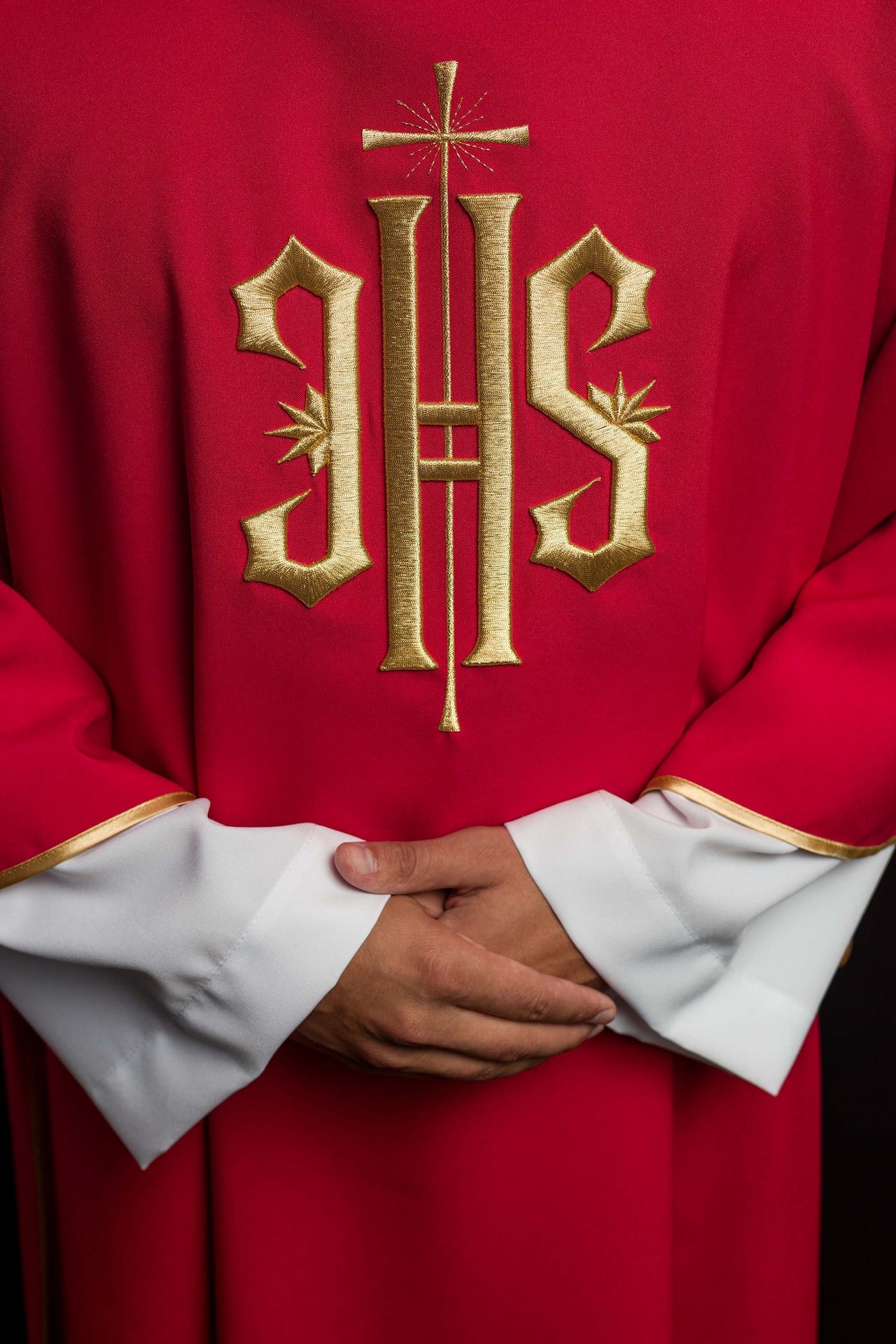 Red Dalmatics with embroidered gold IHS