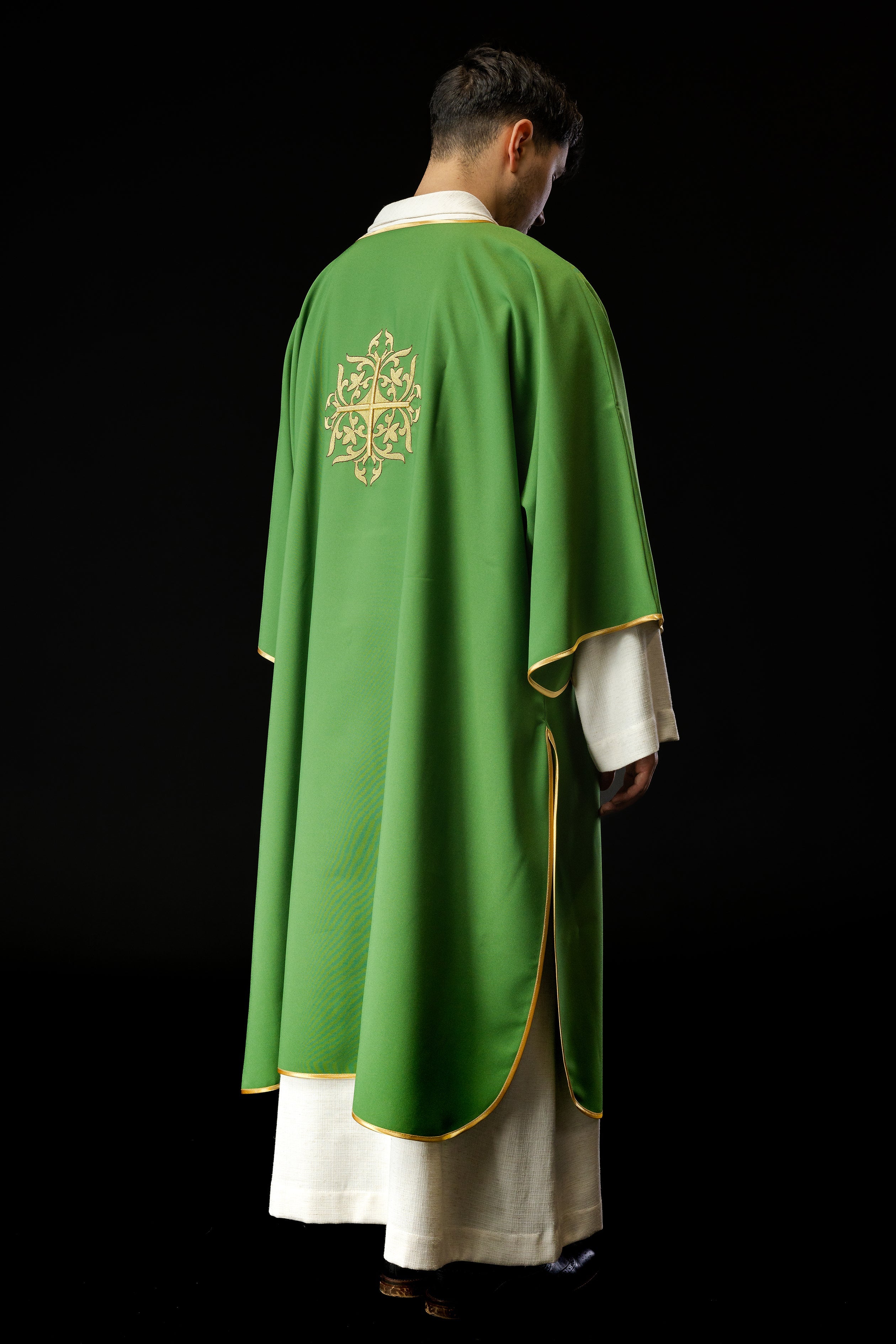 Green Dalmatian with embroidered gold cross