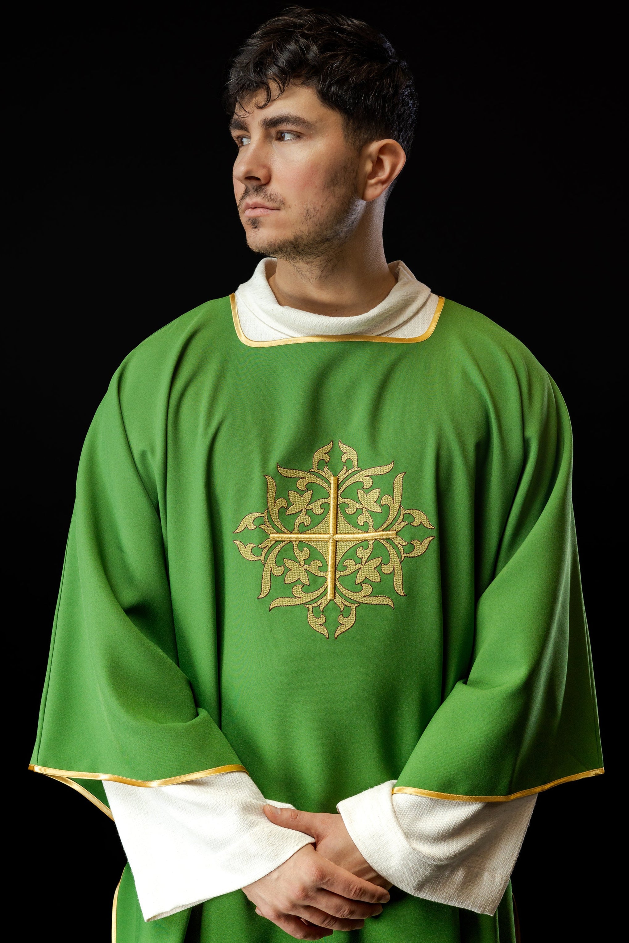 Green Dalmatian with embroidered gold cross