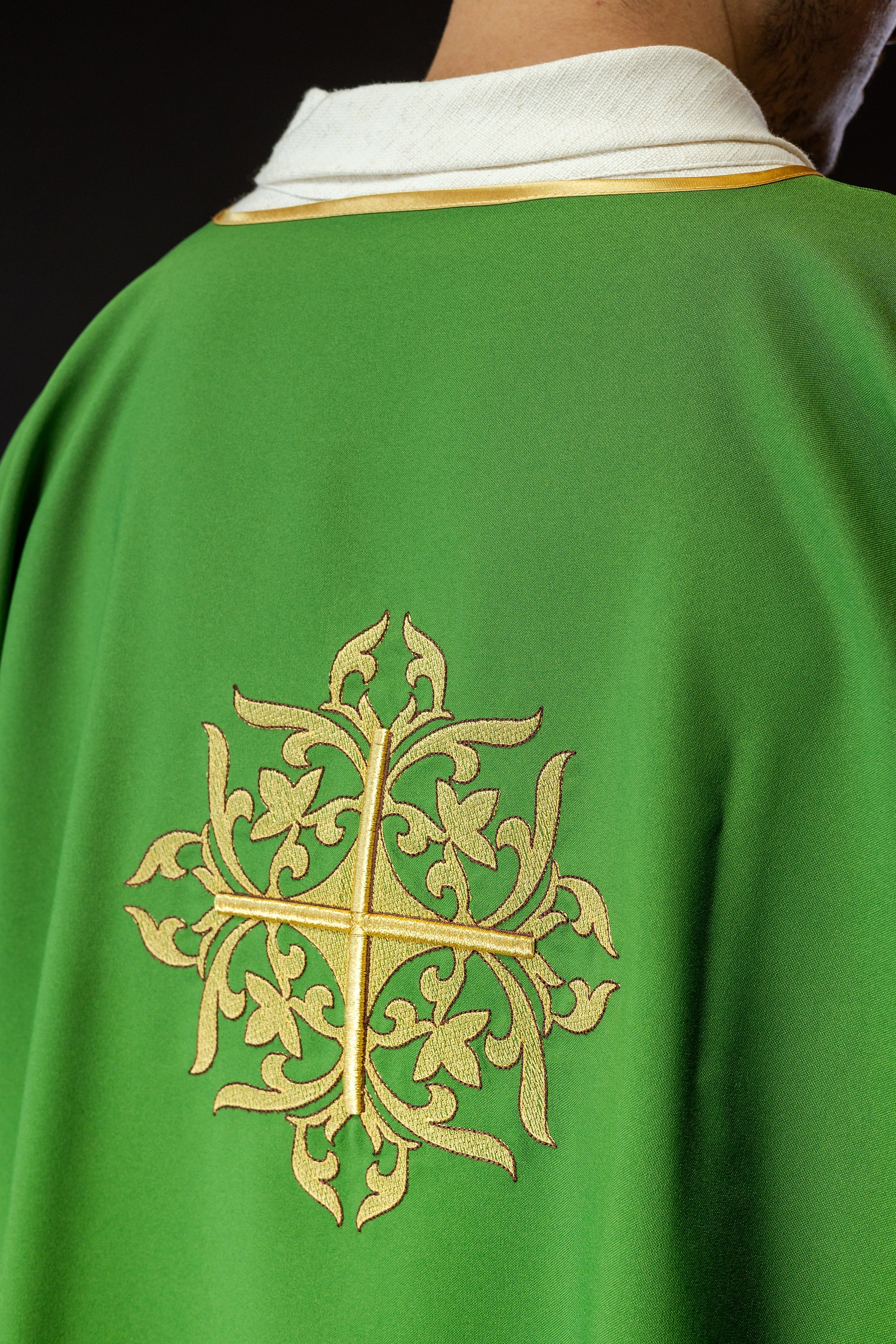 Green Dalmatian with embroidered gold cross