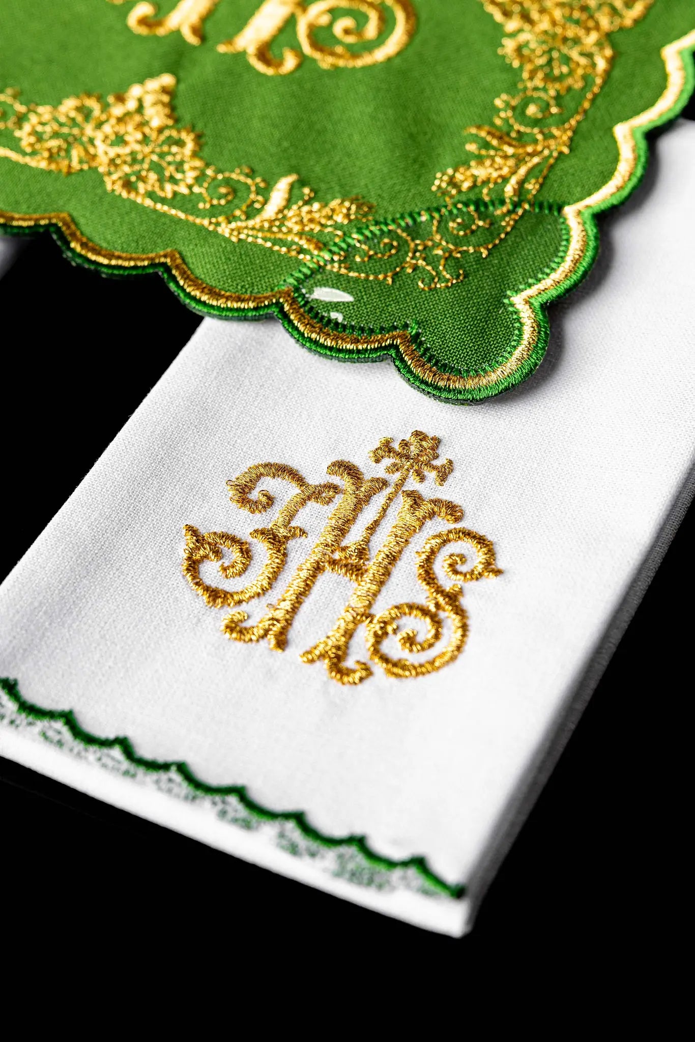 Green chalice linen set with IHS monogram, cross, acanthus leaves, and grapevines embroidered in gold. Includes pall, corporal, purificator, and lavabo towel.