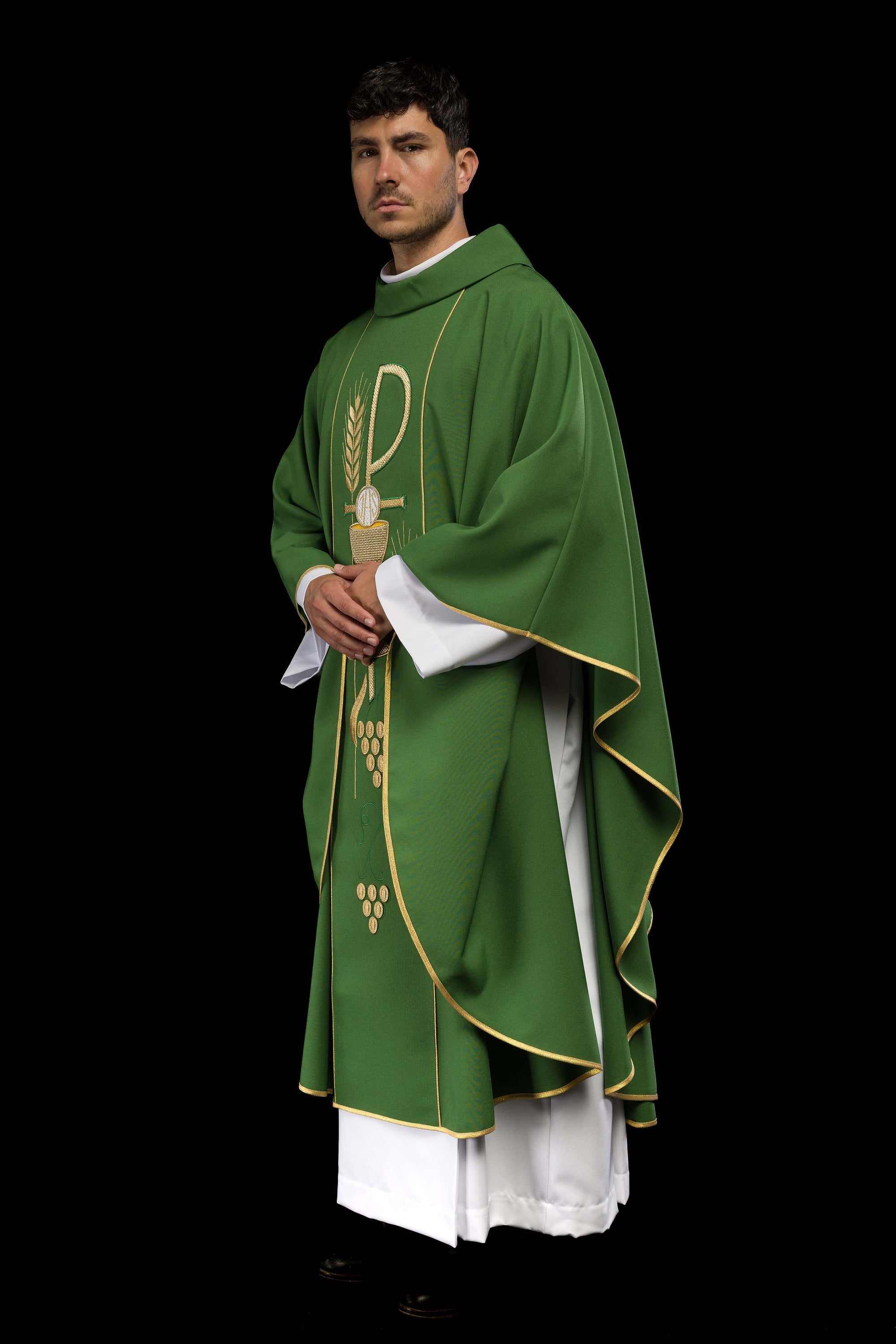 Green chasuble embroidered with IHS chalice design