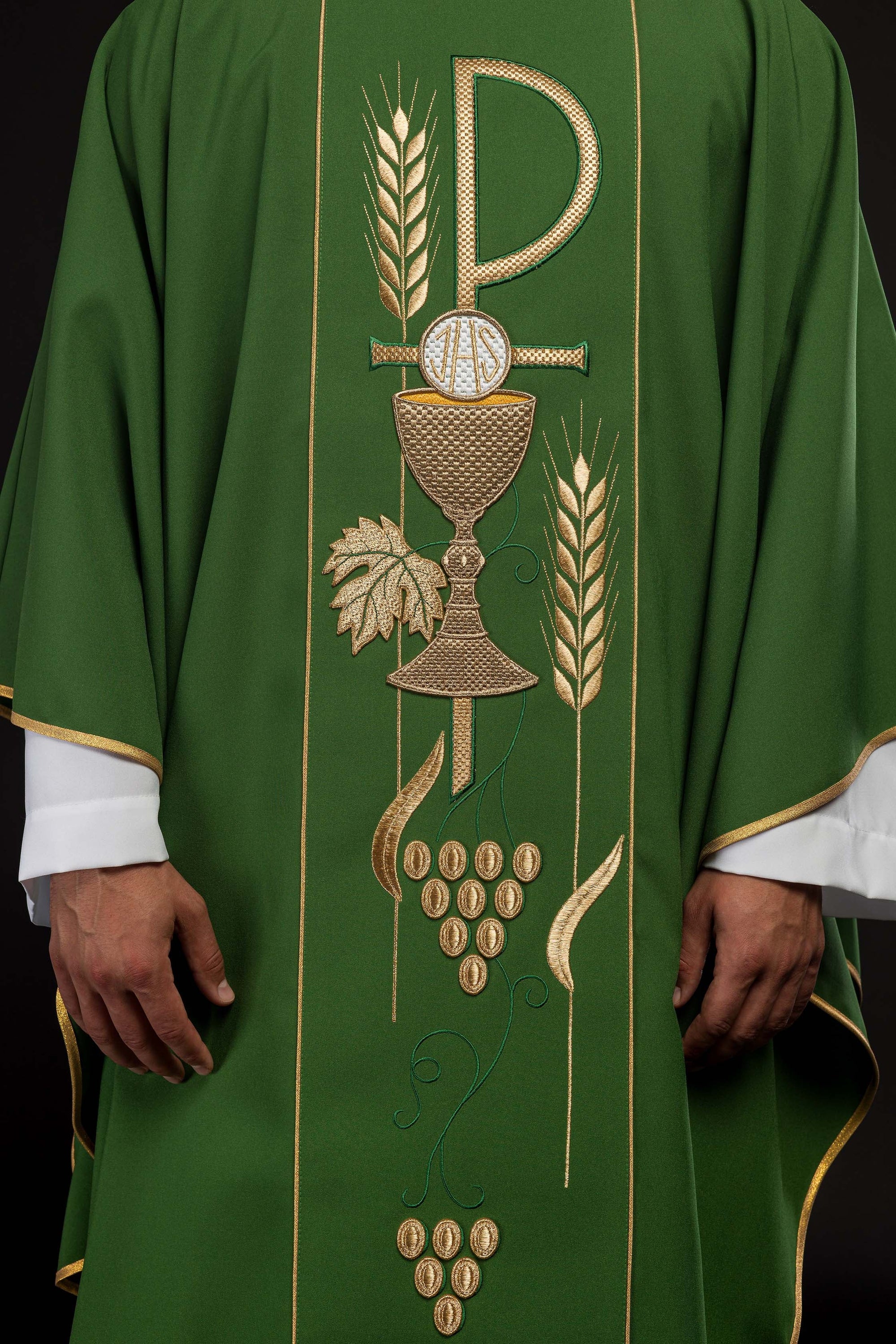 Green chasuble embroidered with IHS chalice design