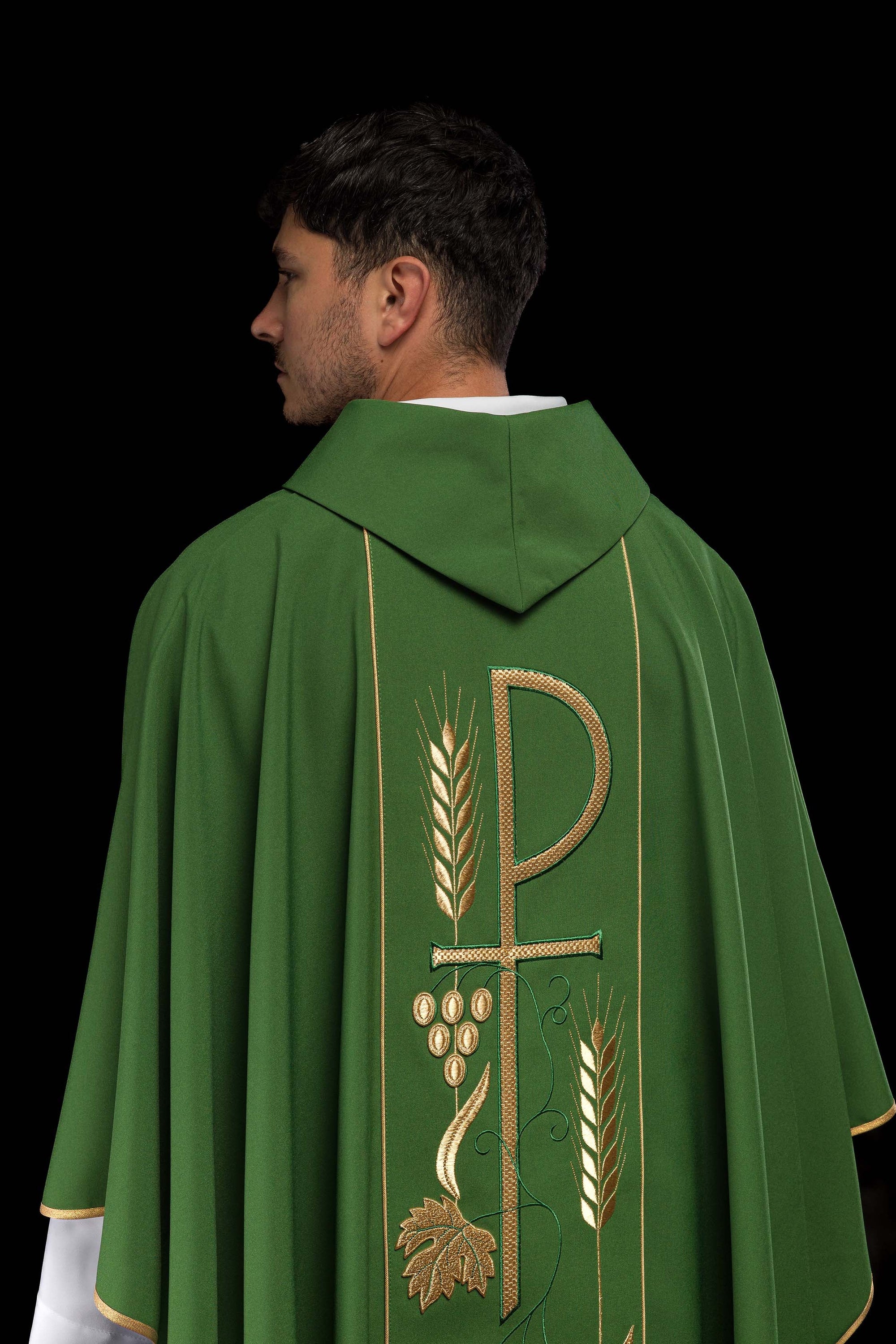 Green chasuble embroidered with IHS chalice design