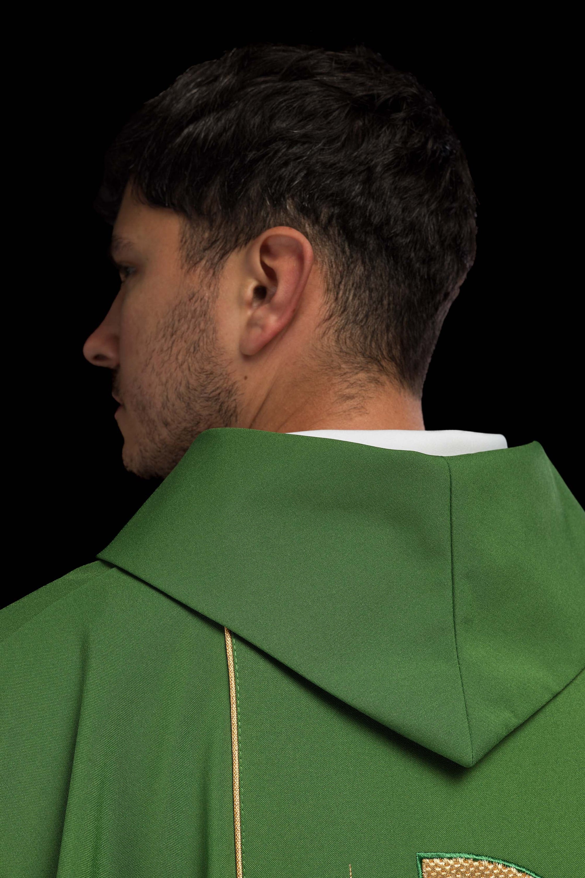 Green chasuble embroidered with IHS chalice design