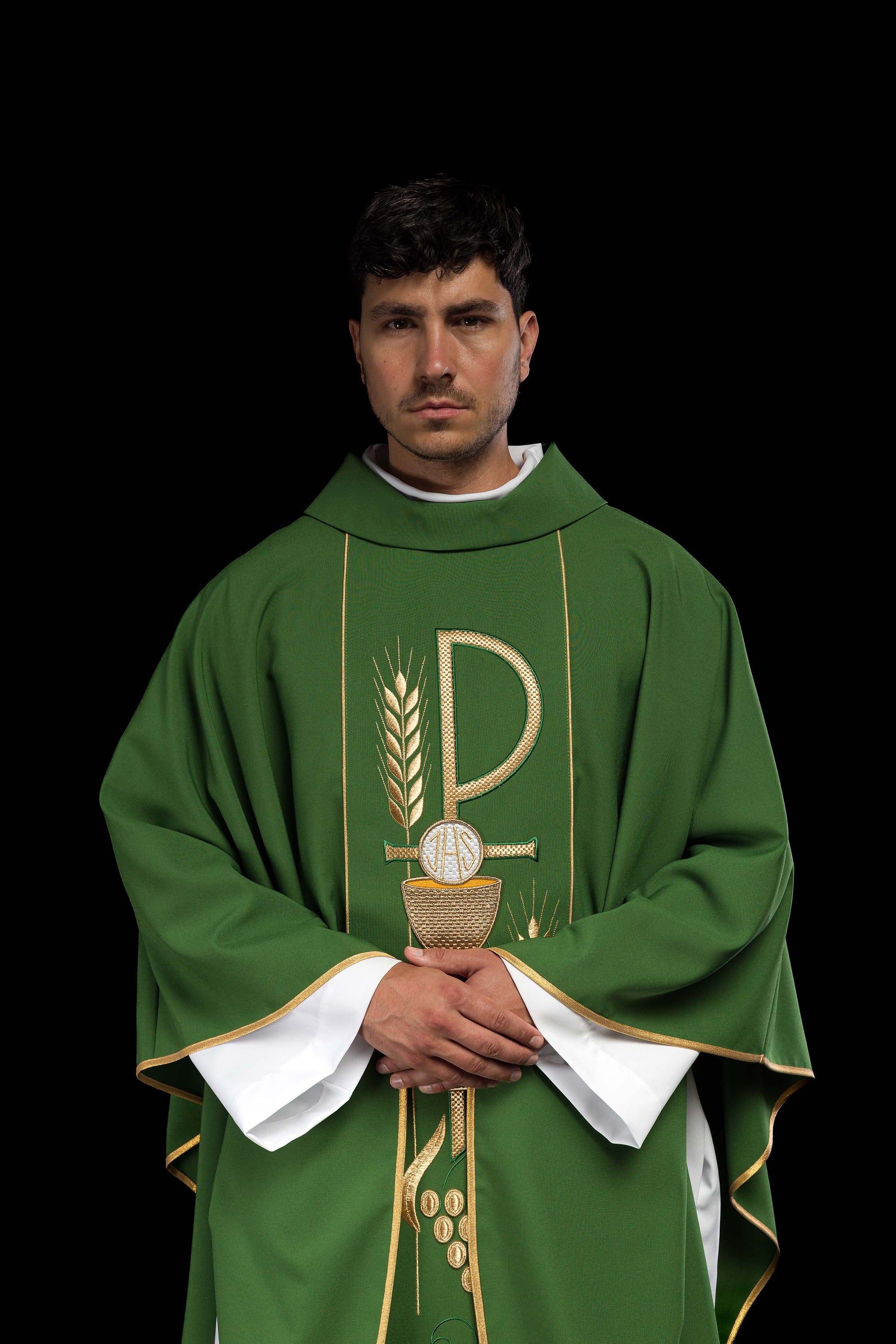 Green chasuble embroidered with IHS chalice design