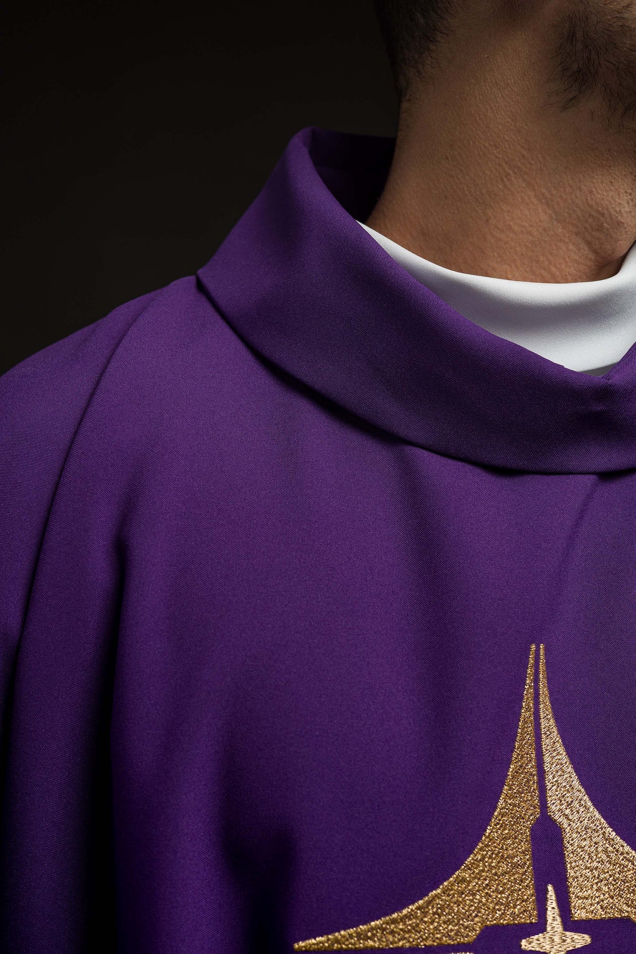 Purple chasuble embroidered with cross motif