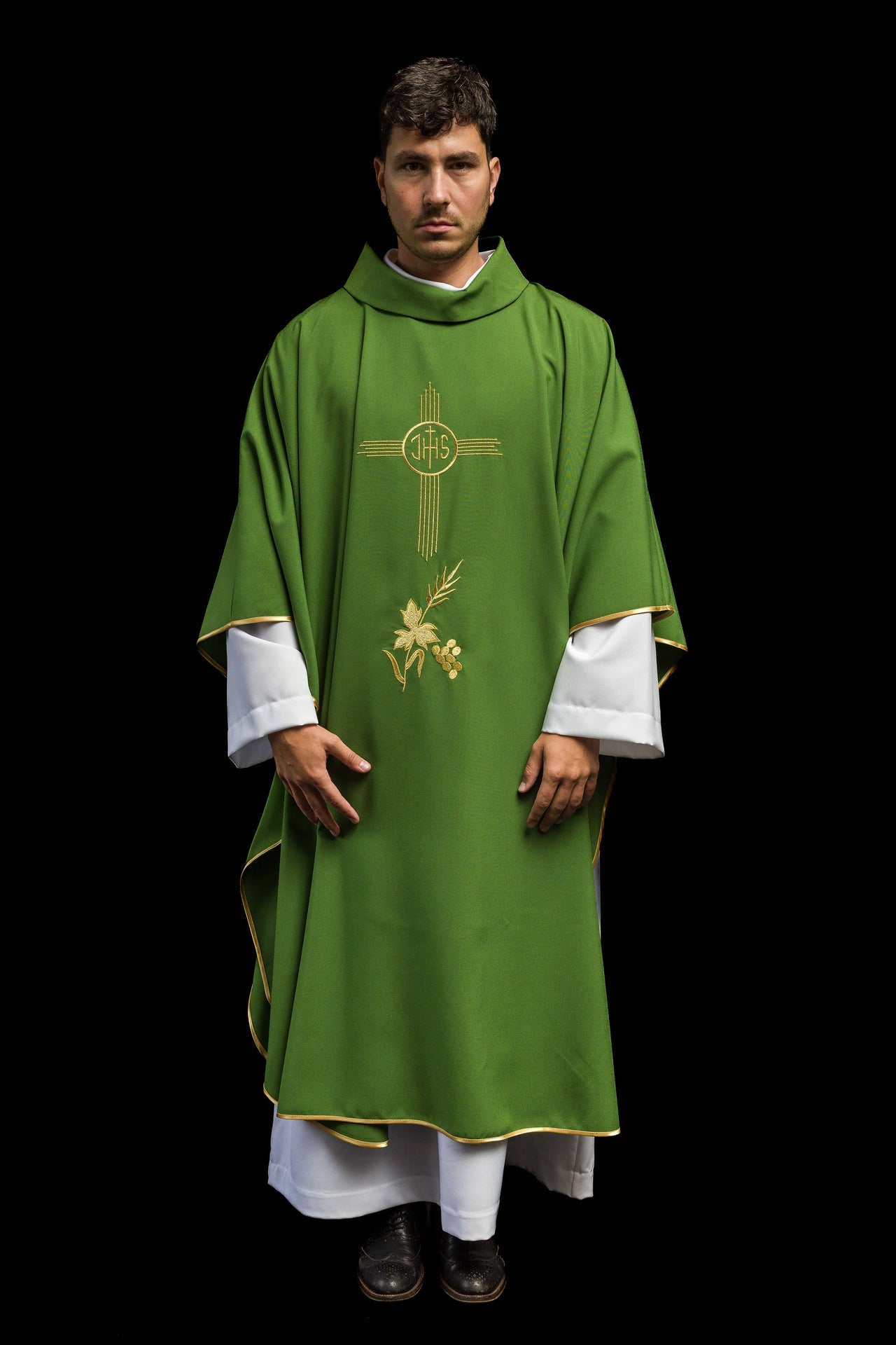 Green chasuble embroidered with IHS motif