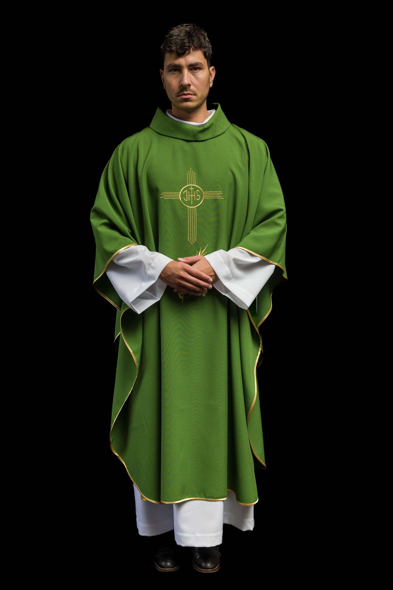 Green chasuble embroidered with IHS motif
