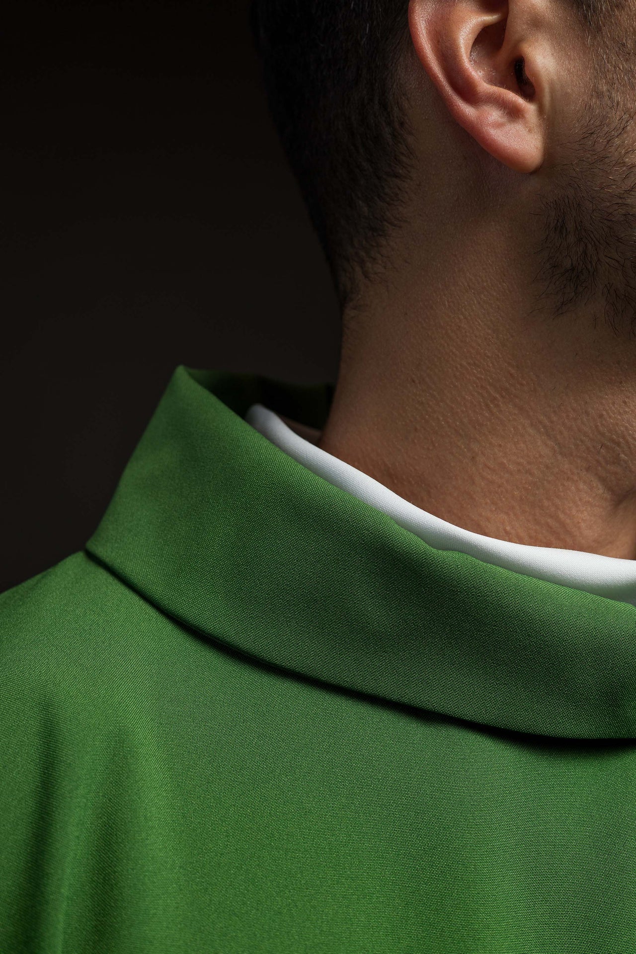 Green chasuble embroidered with IHS motif