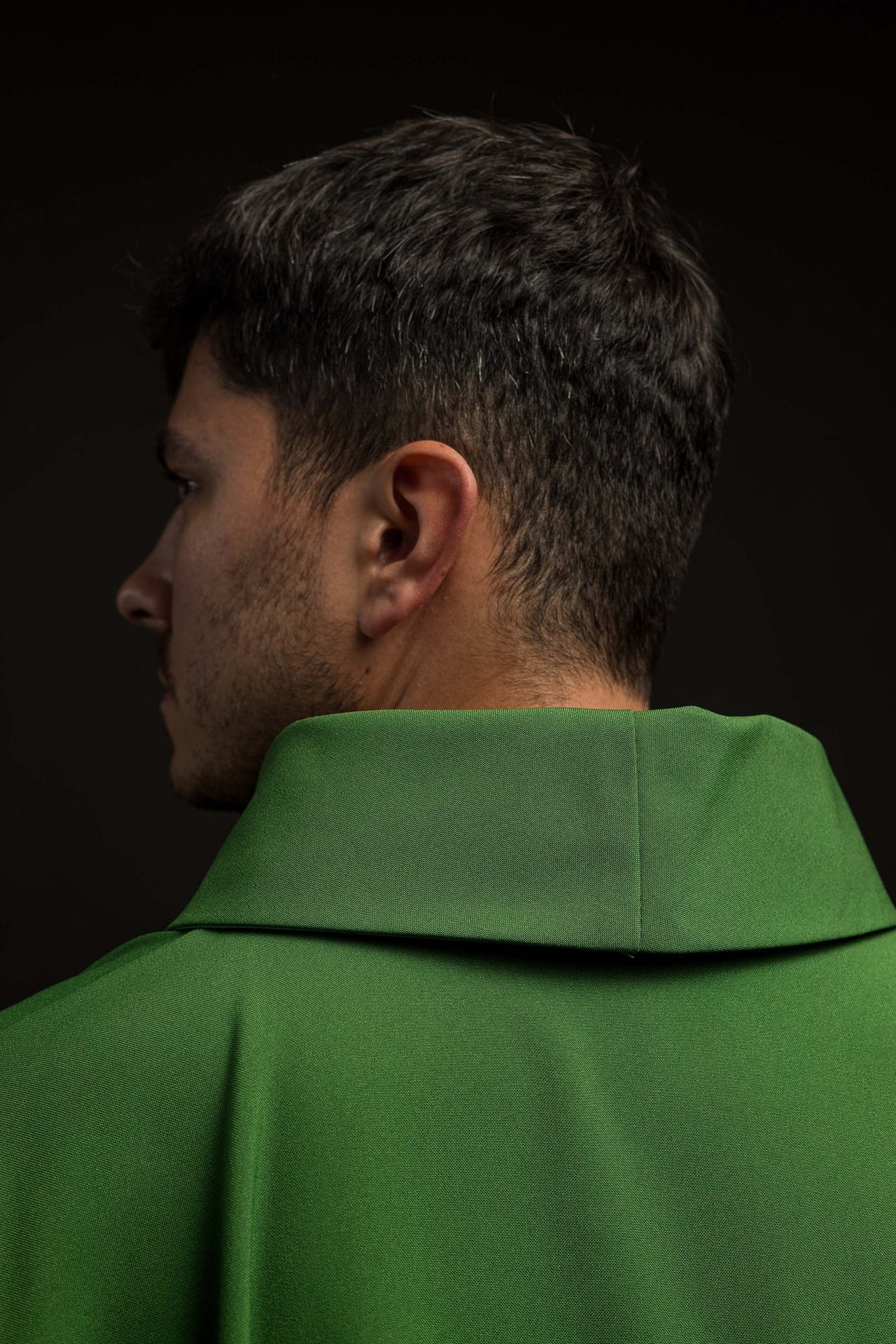 Green chasuble embroidered with IHS motif