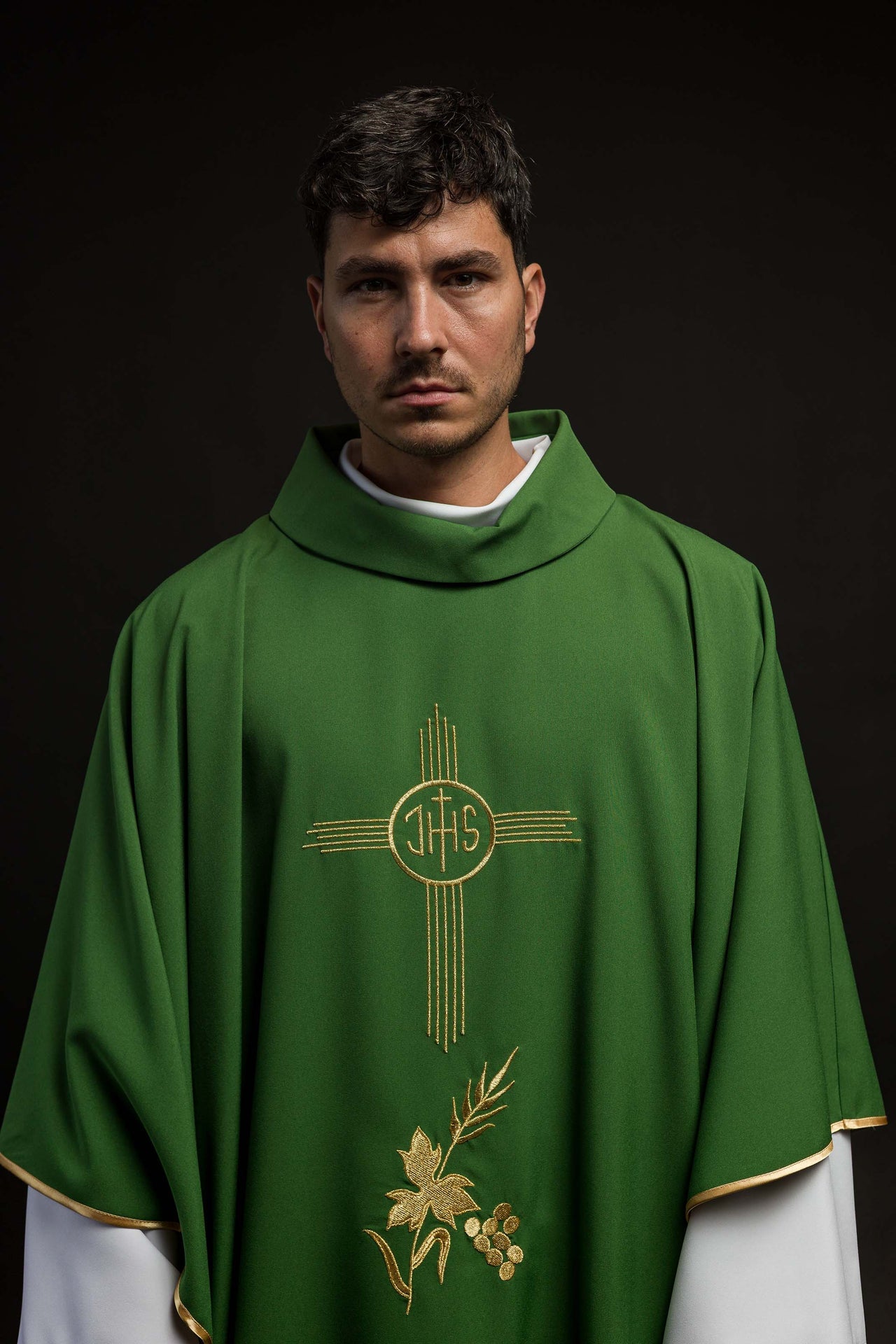 Green chasuble embroidered with IHS motif