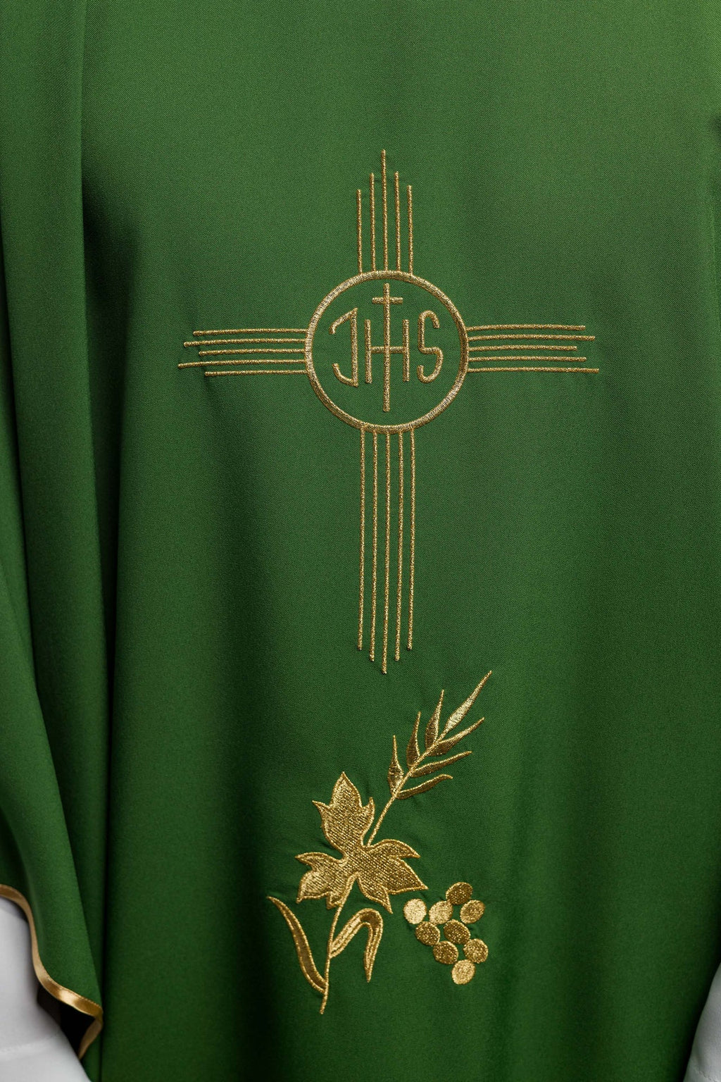 Green chasuble embroidered with IHS motif