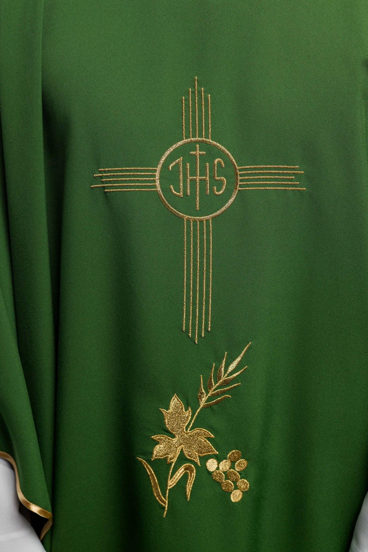 Green chasuble embroidered with IHS motif