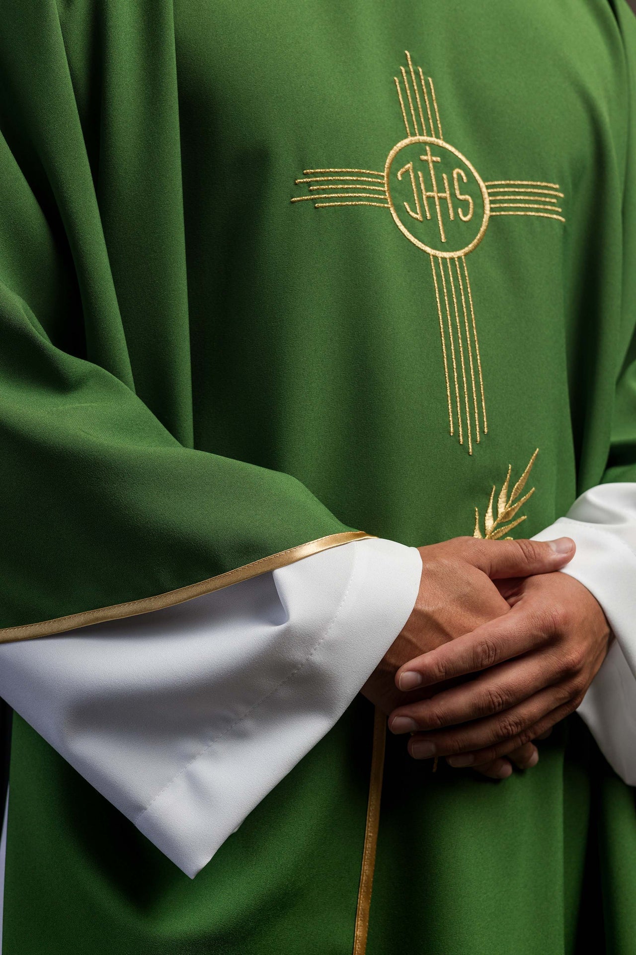 Green chasuble embroidered with IHS motif