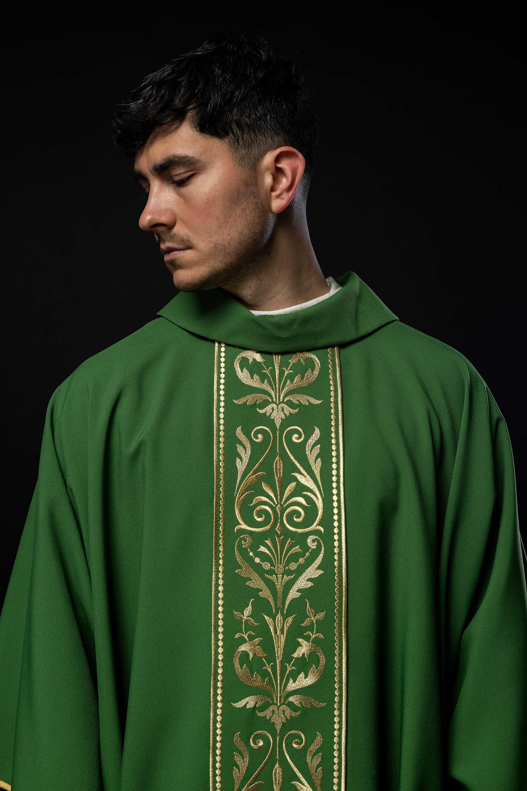 Green liturgical chasuble decorated with gold embroidered belt